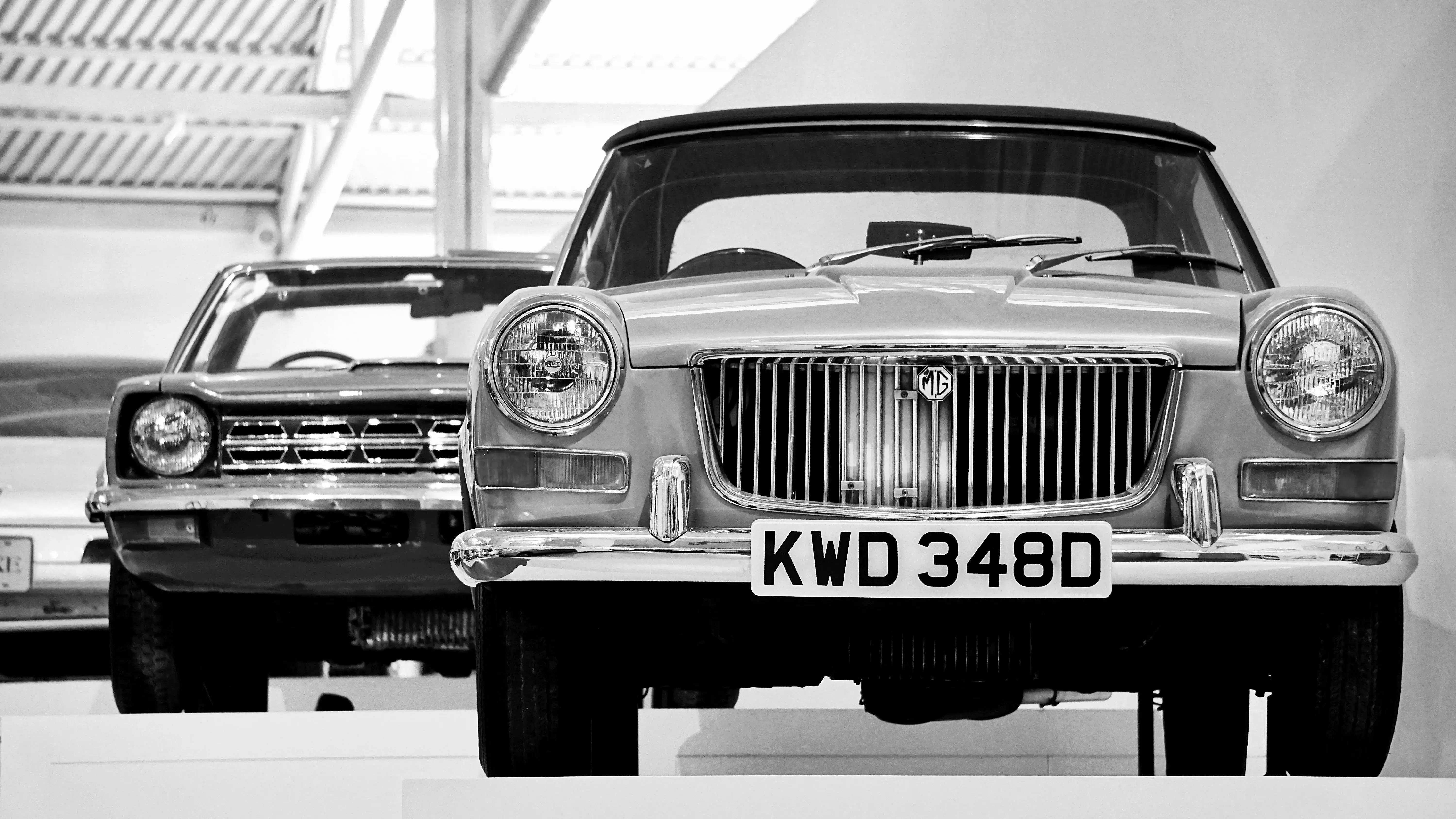 Grayscale Photo of Vintage Cars