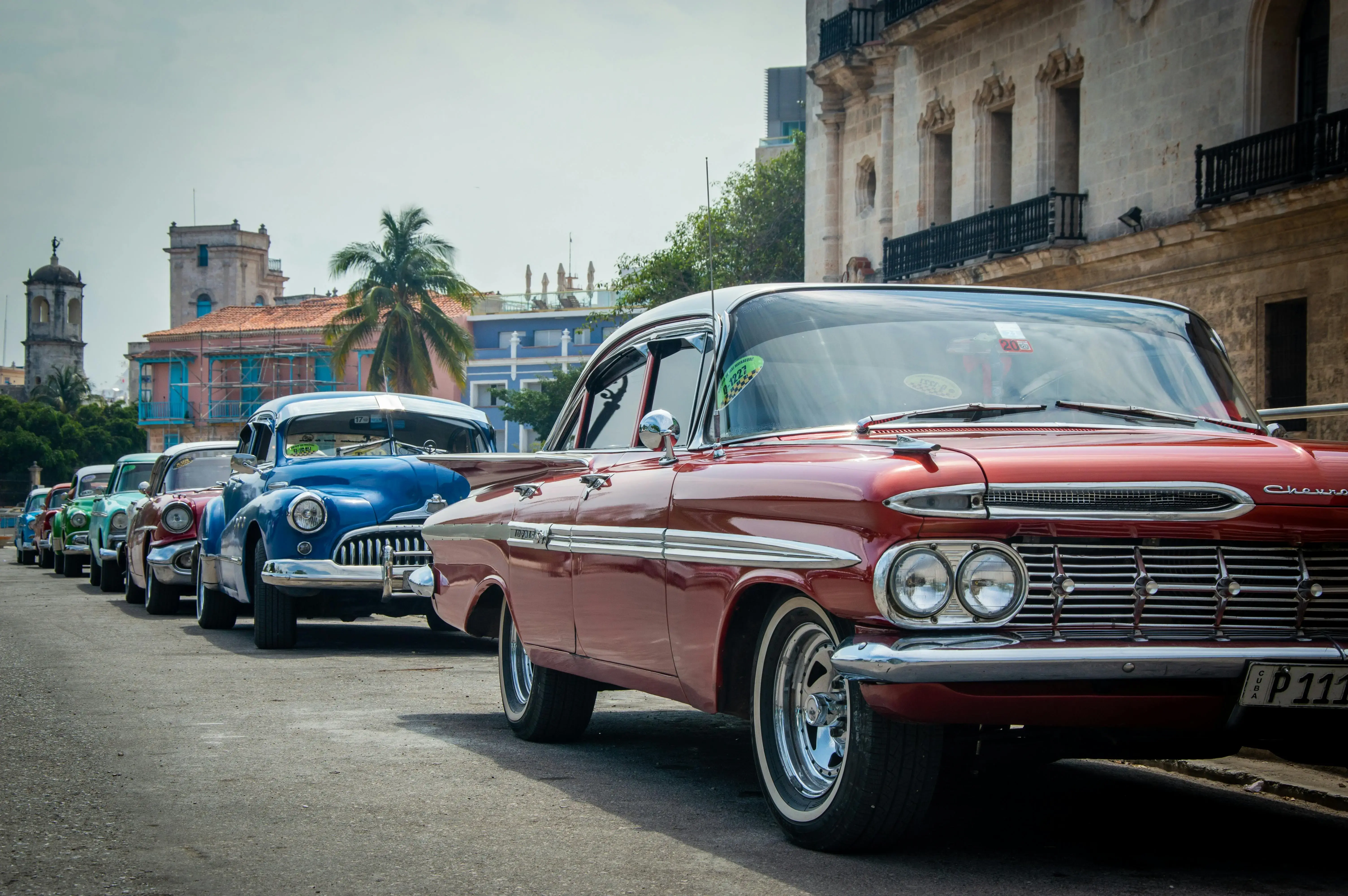 Vintage Cars Parked on Street in Town
