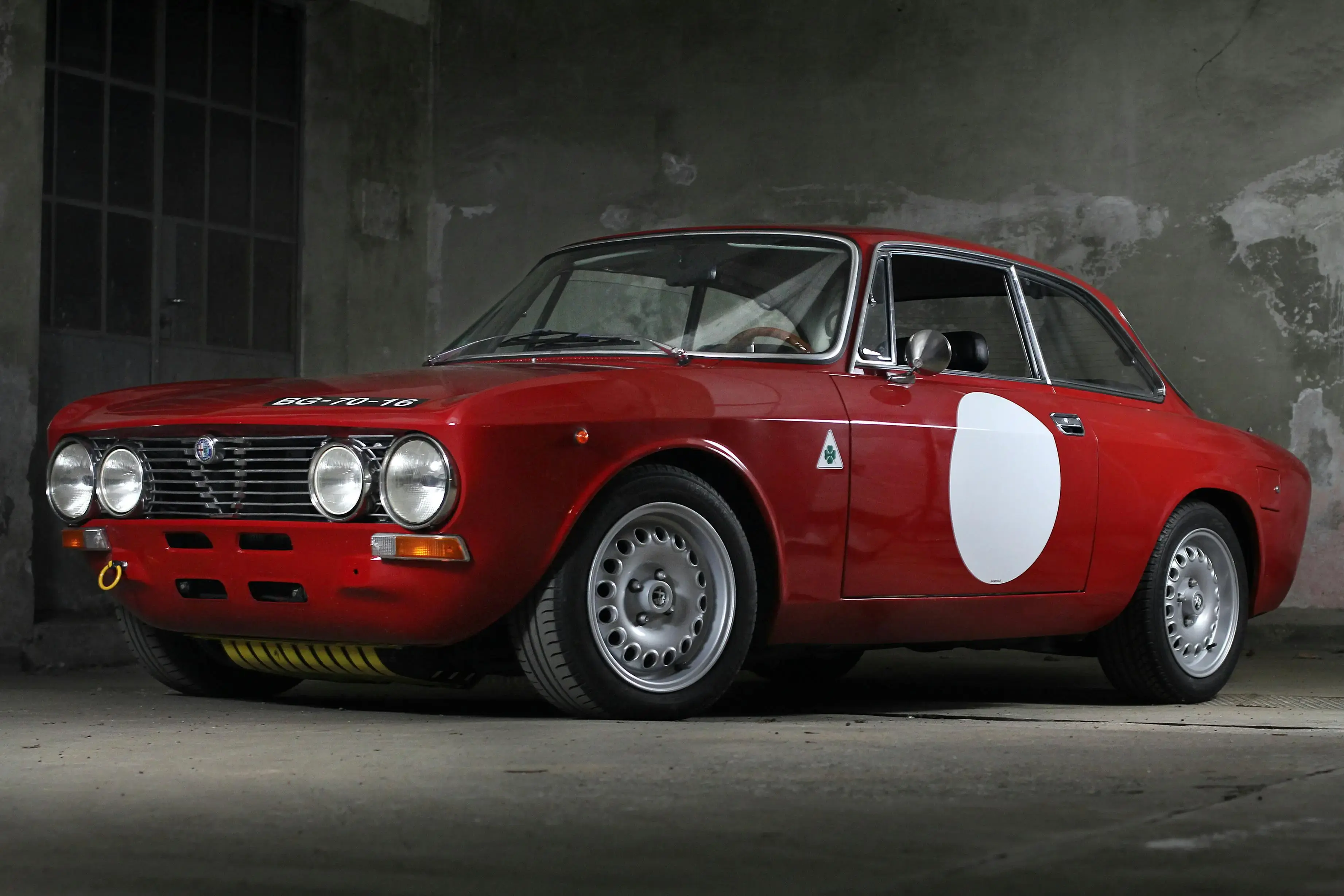 A vintage red Alfa Romeo race car