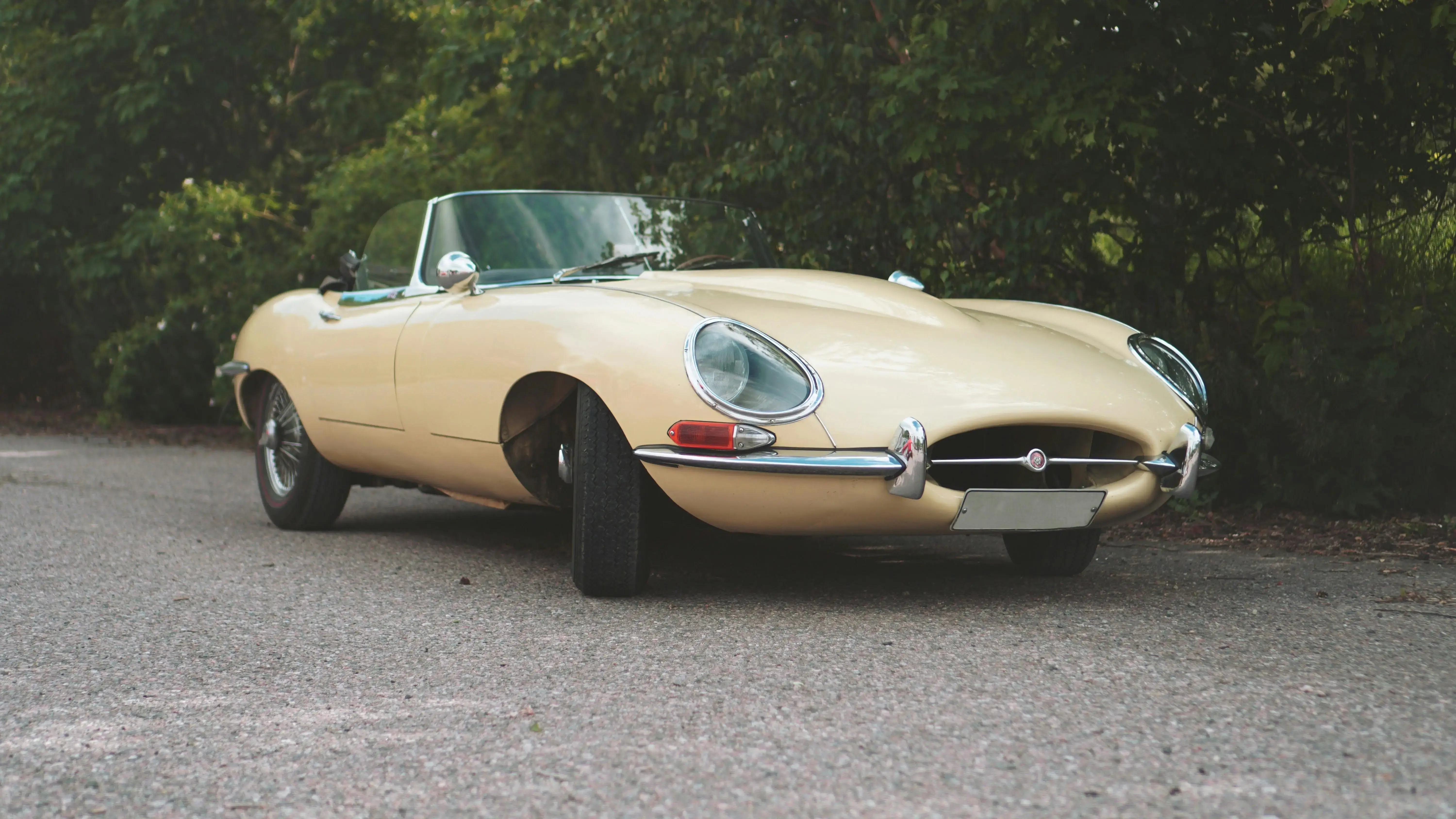 A Beige Classic Car Parked on the Road