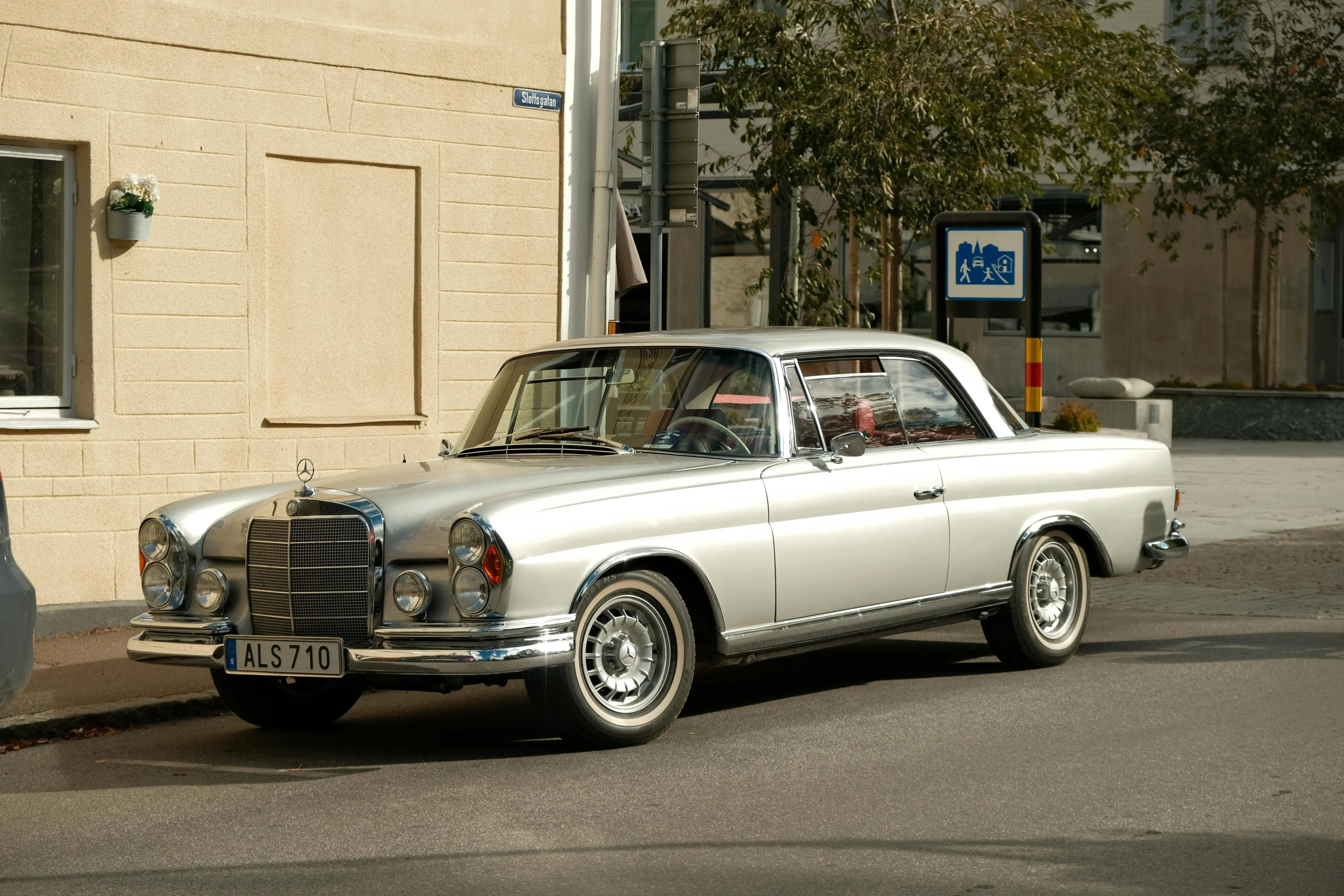 Classic Silver Car Parked on Urban Street