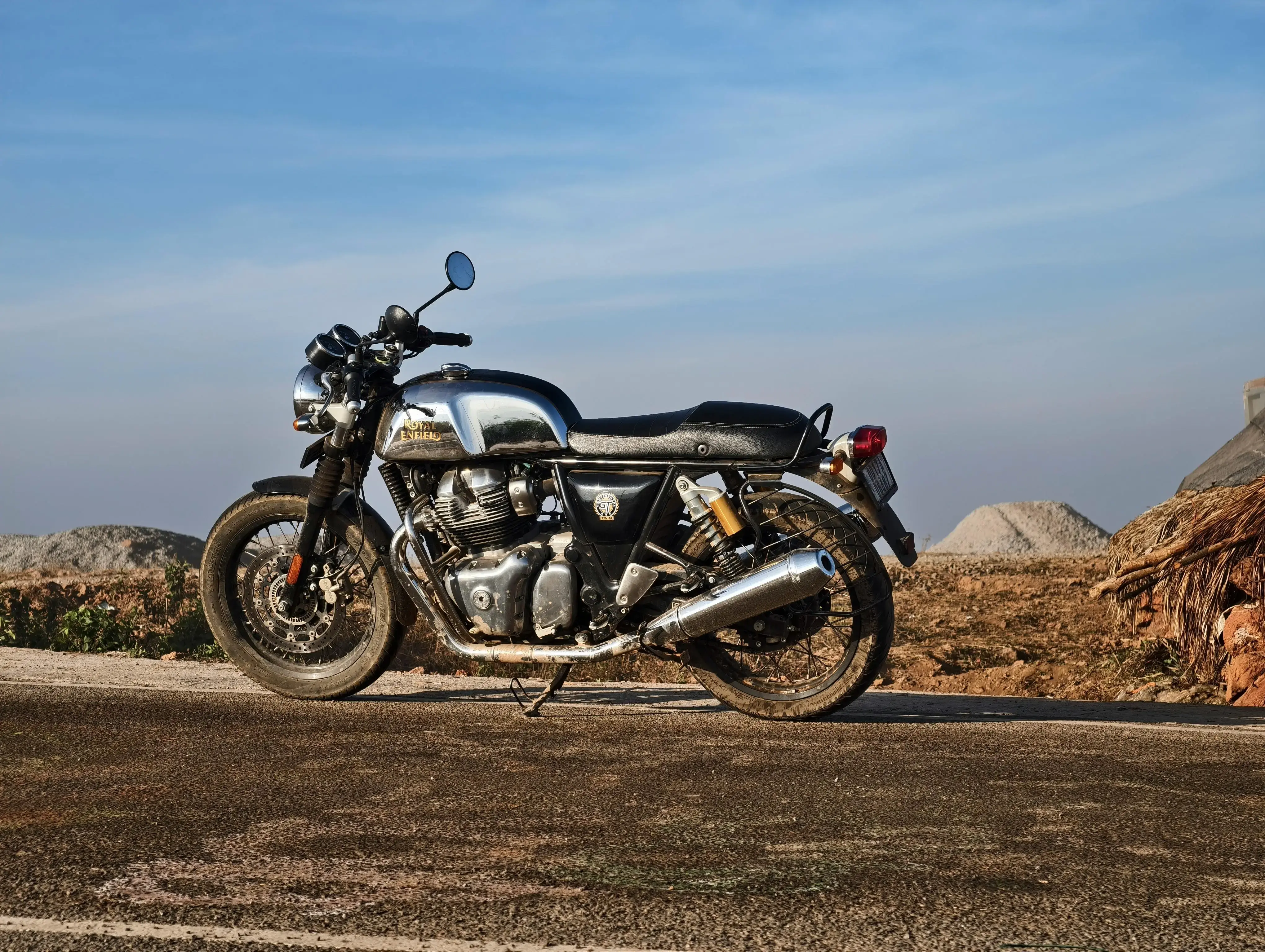 Classic Motorcycle on Open Road under Blue Sky
