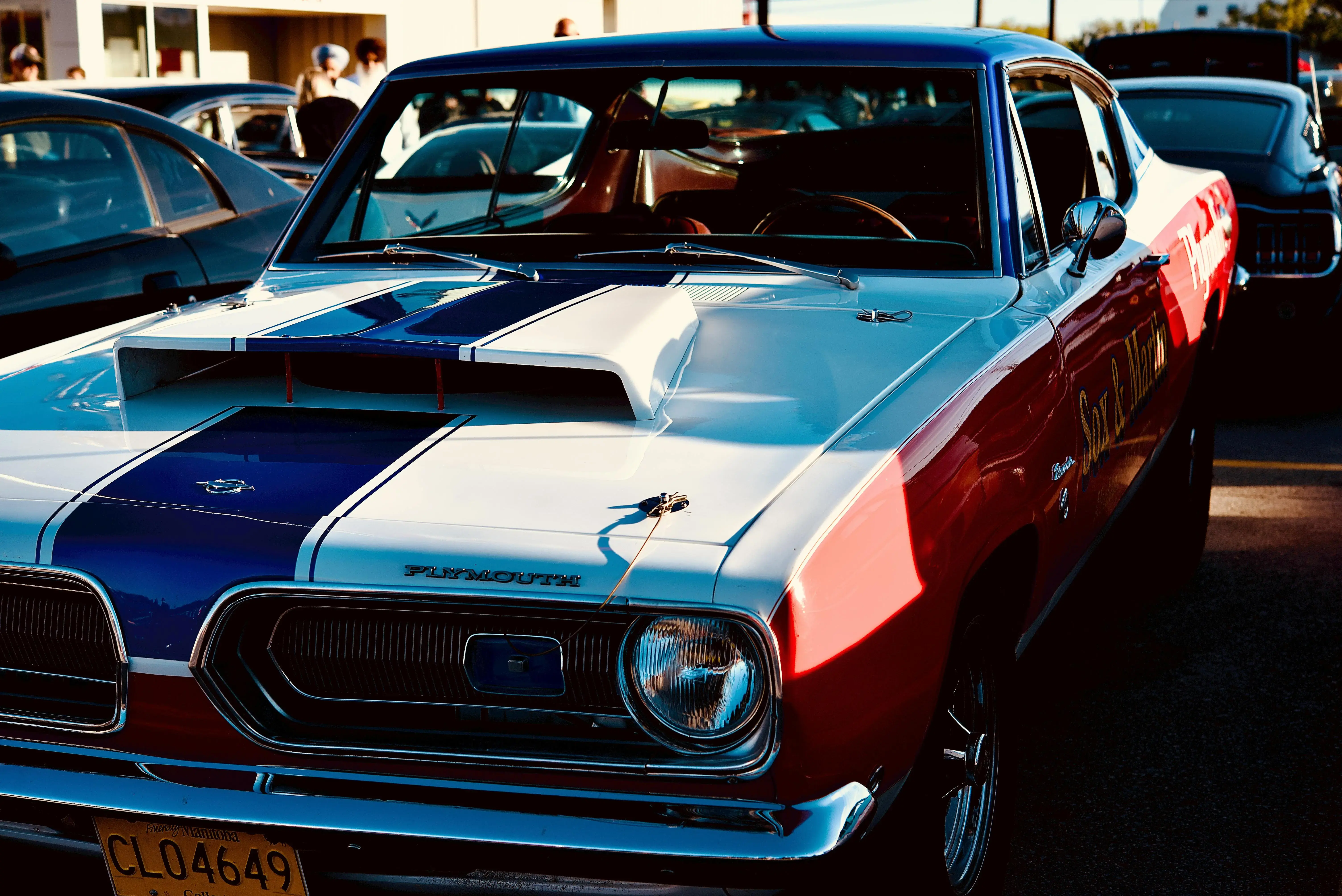 Classic Red and White Vintage Plymouth Coupe at Car Show