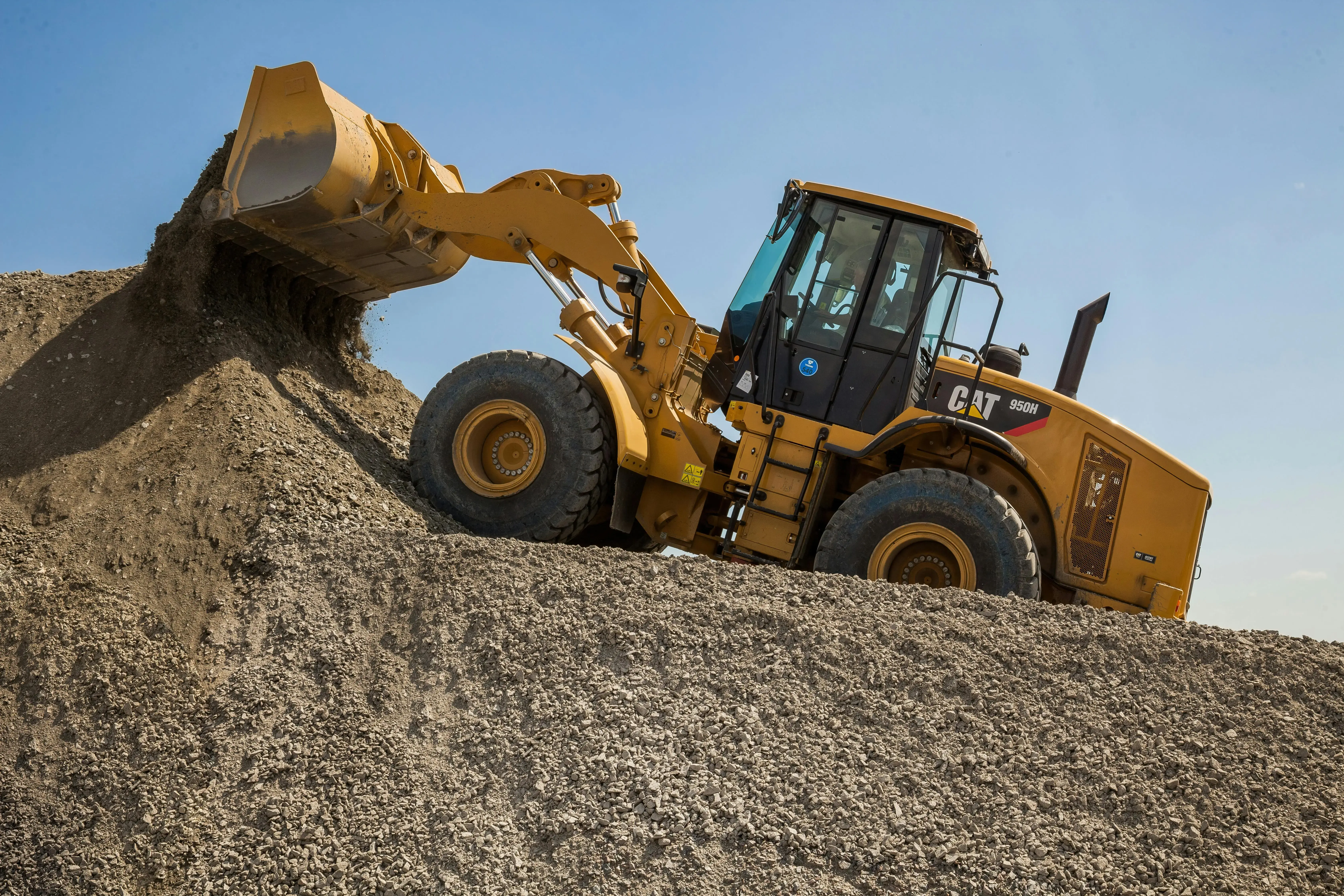 Heavy Machinery Moving Gravel in Quarry