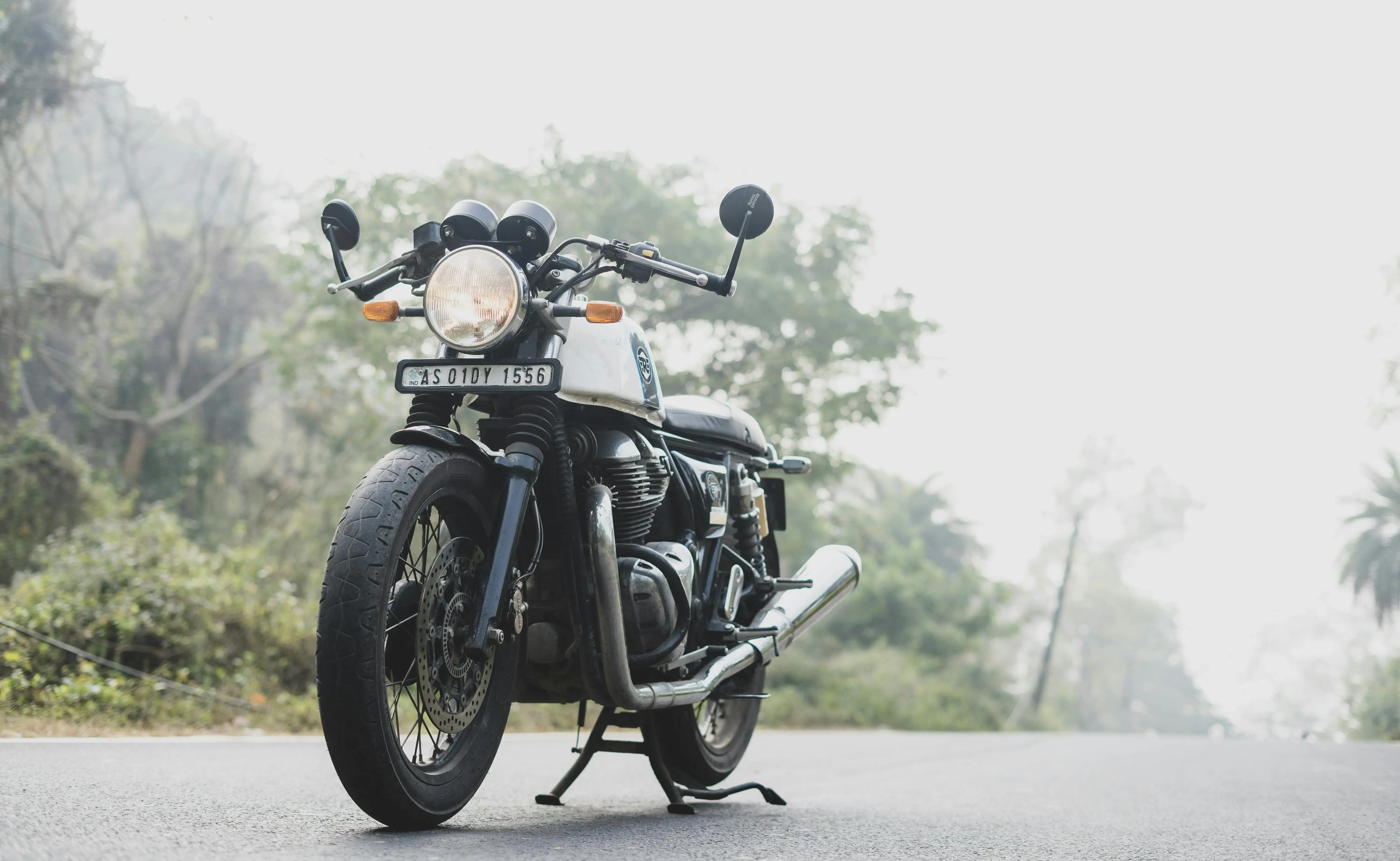 Black Motorcycle On Gray Asphalt Road
