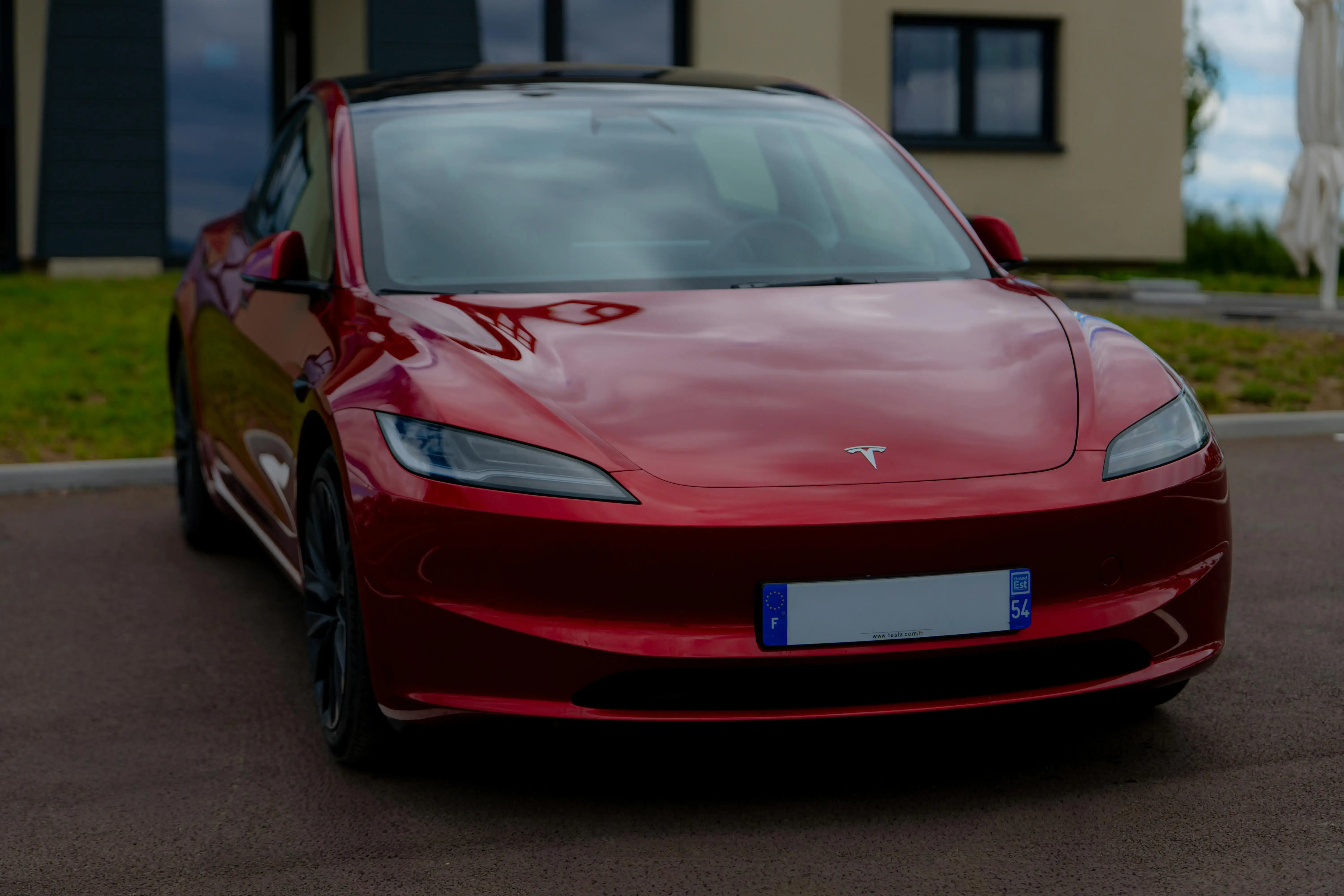 Sleek Red Electric Car Parked Outdoors