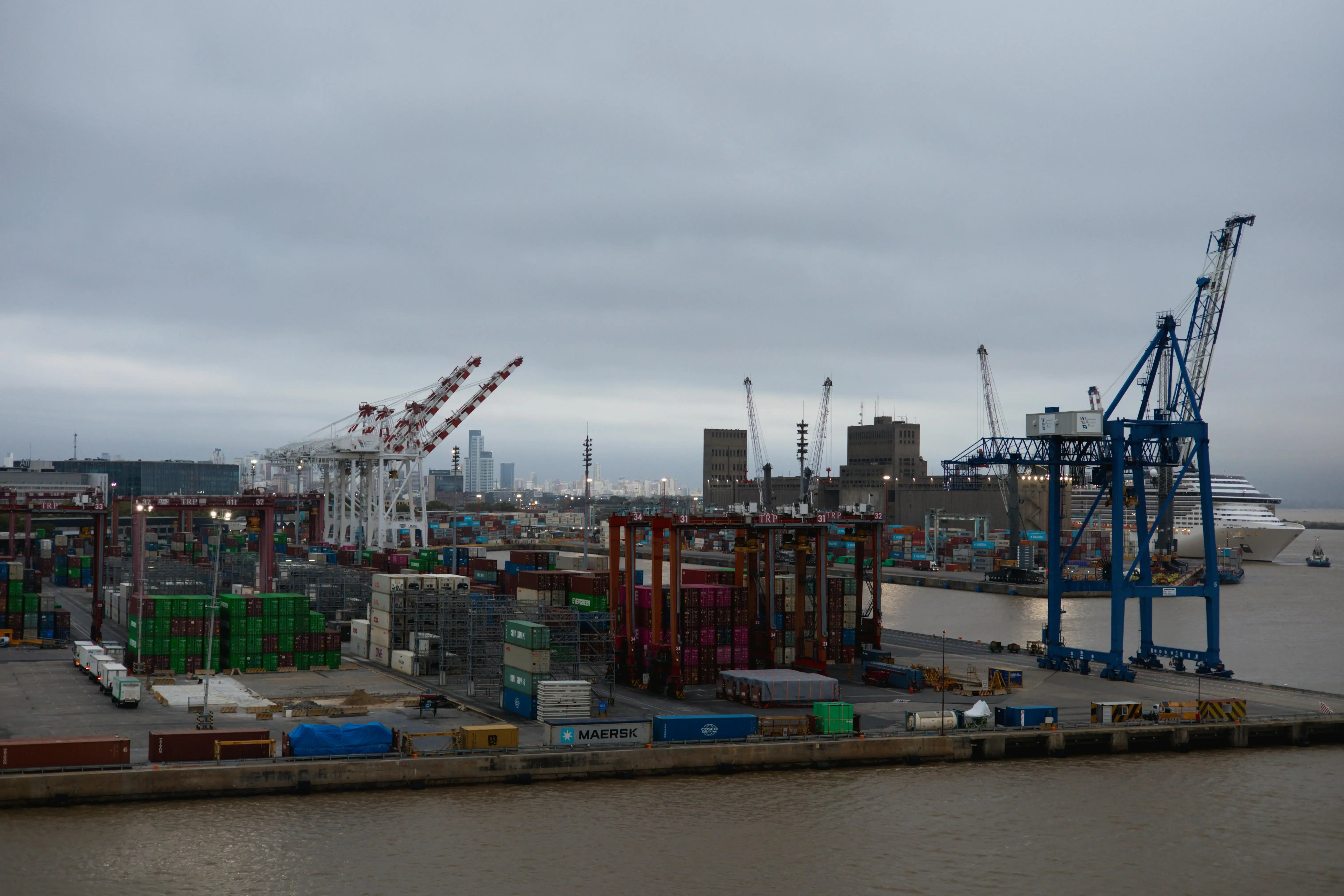 Busy Industrial Port with Cargo Cranes and Ships