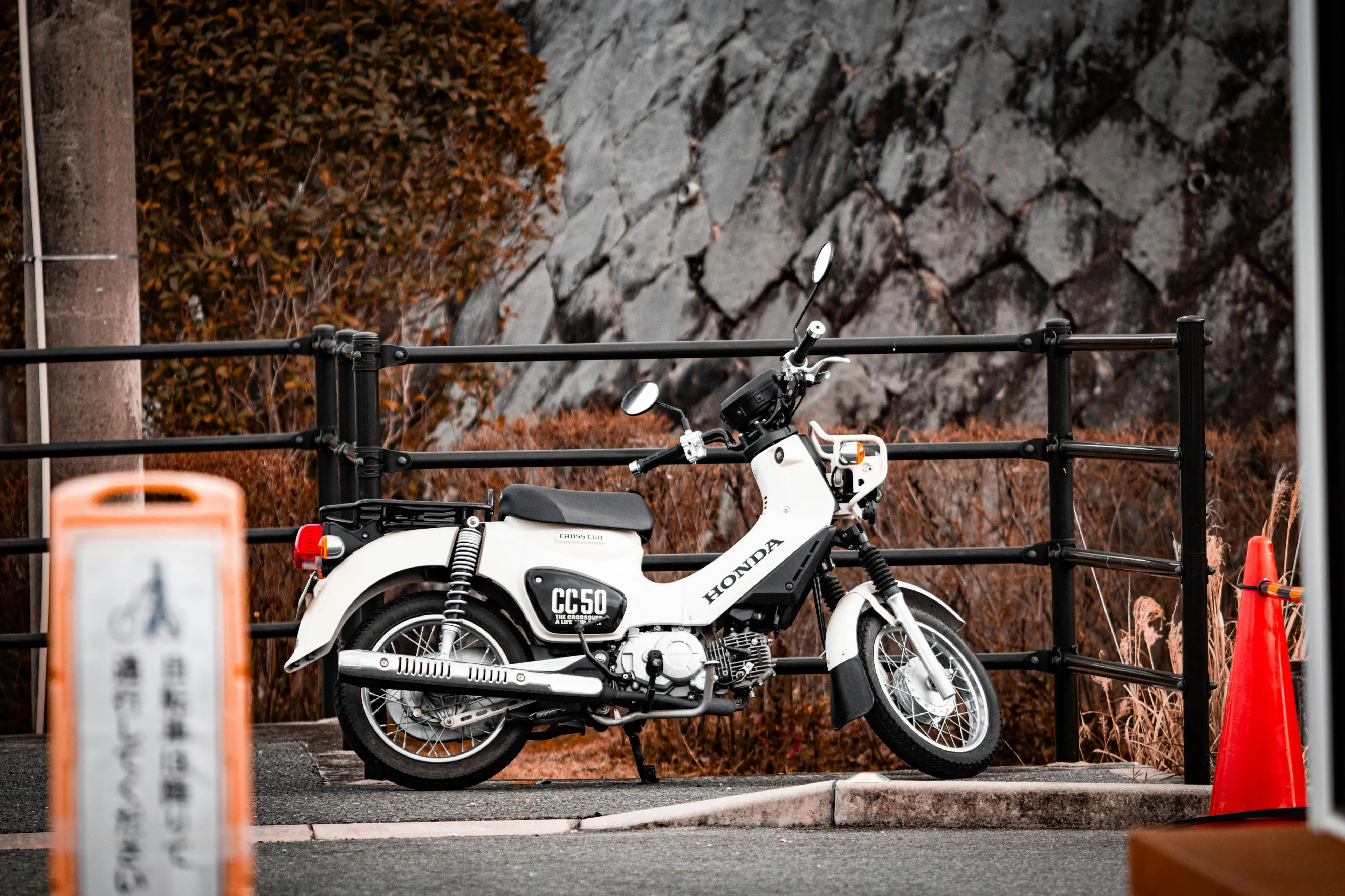 Classic White Honda Motorcycle Parked Outdoors