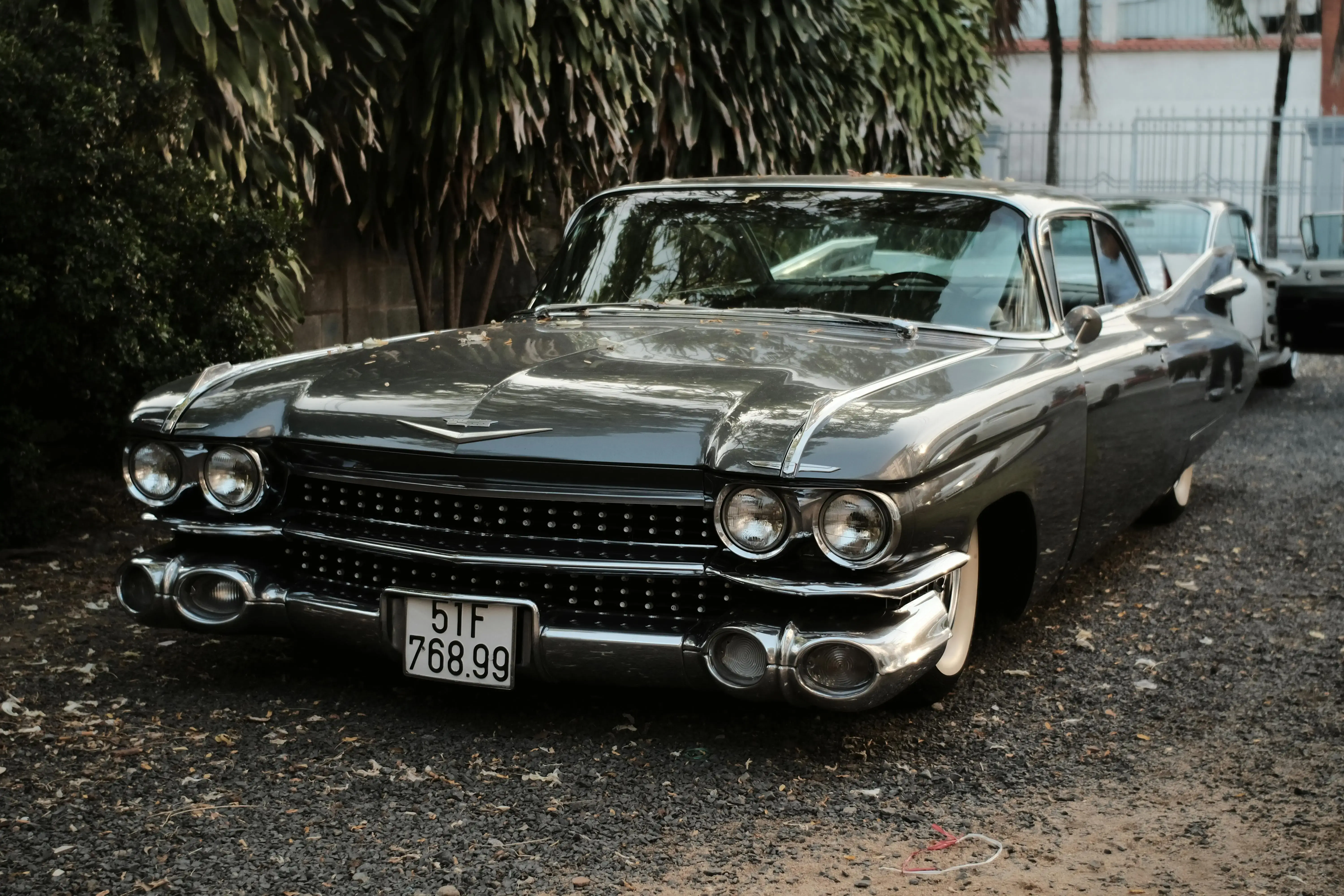 A Black Vintage Car Parked Outdoors
