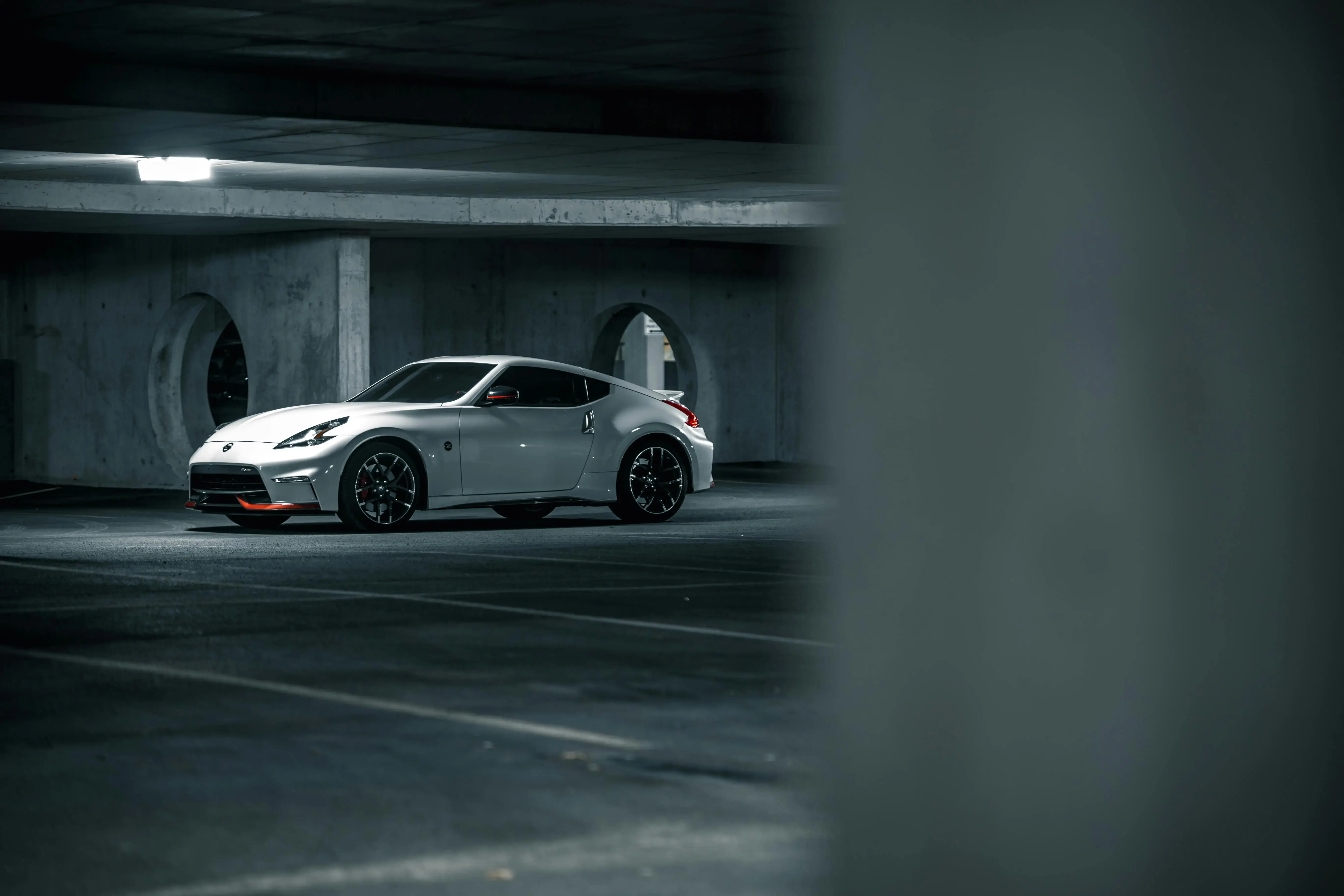 White car on empty parking lot