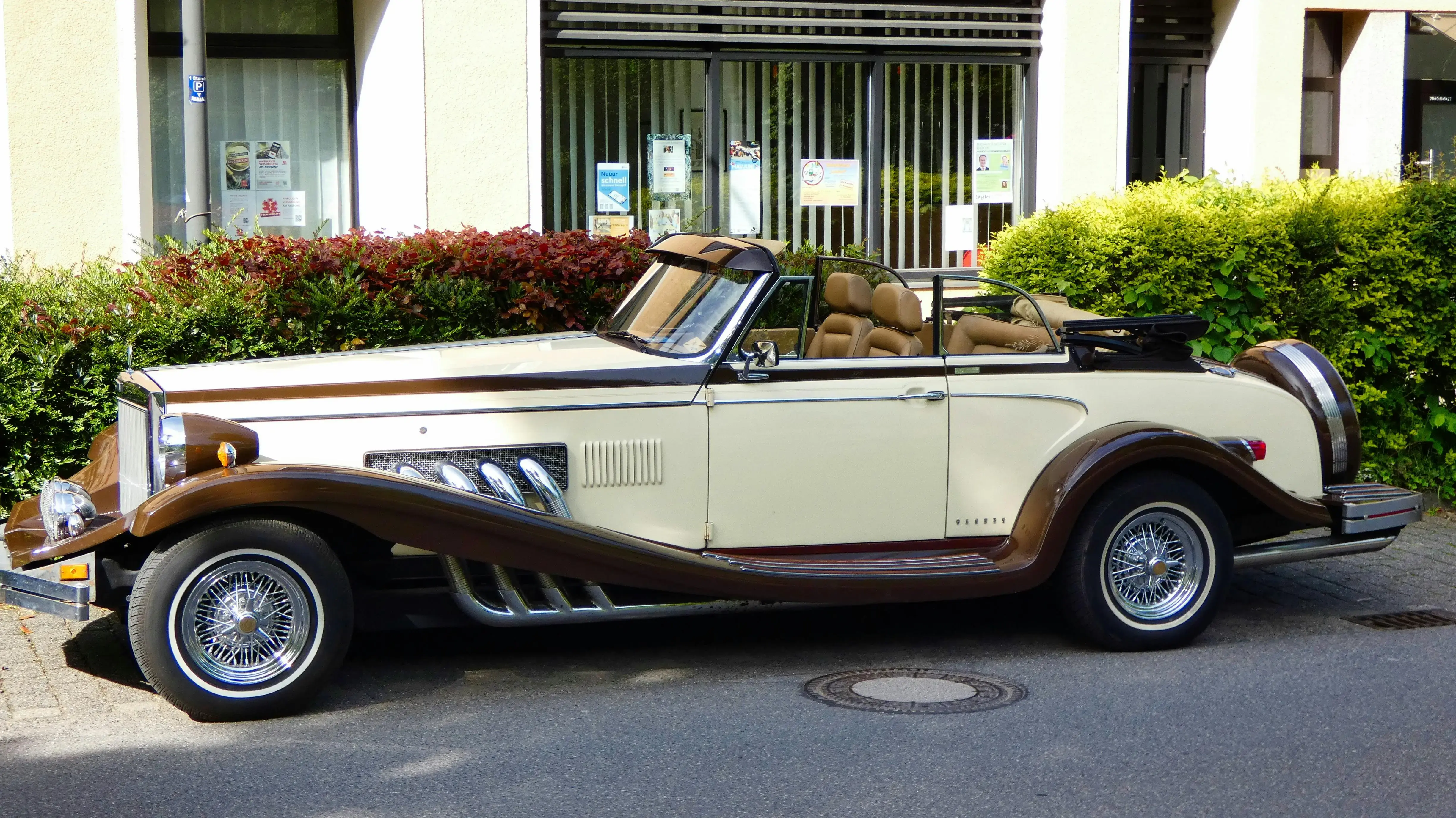 A vintage car parked on the side of the road