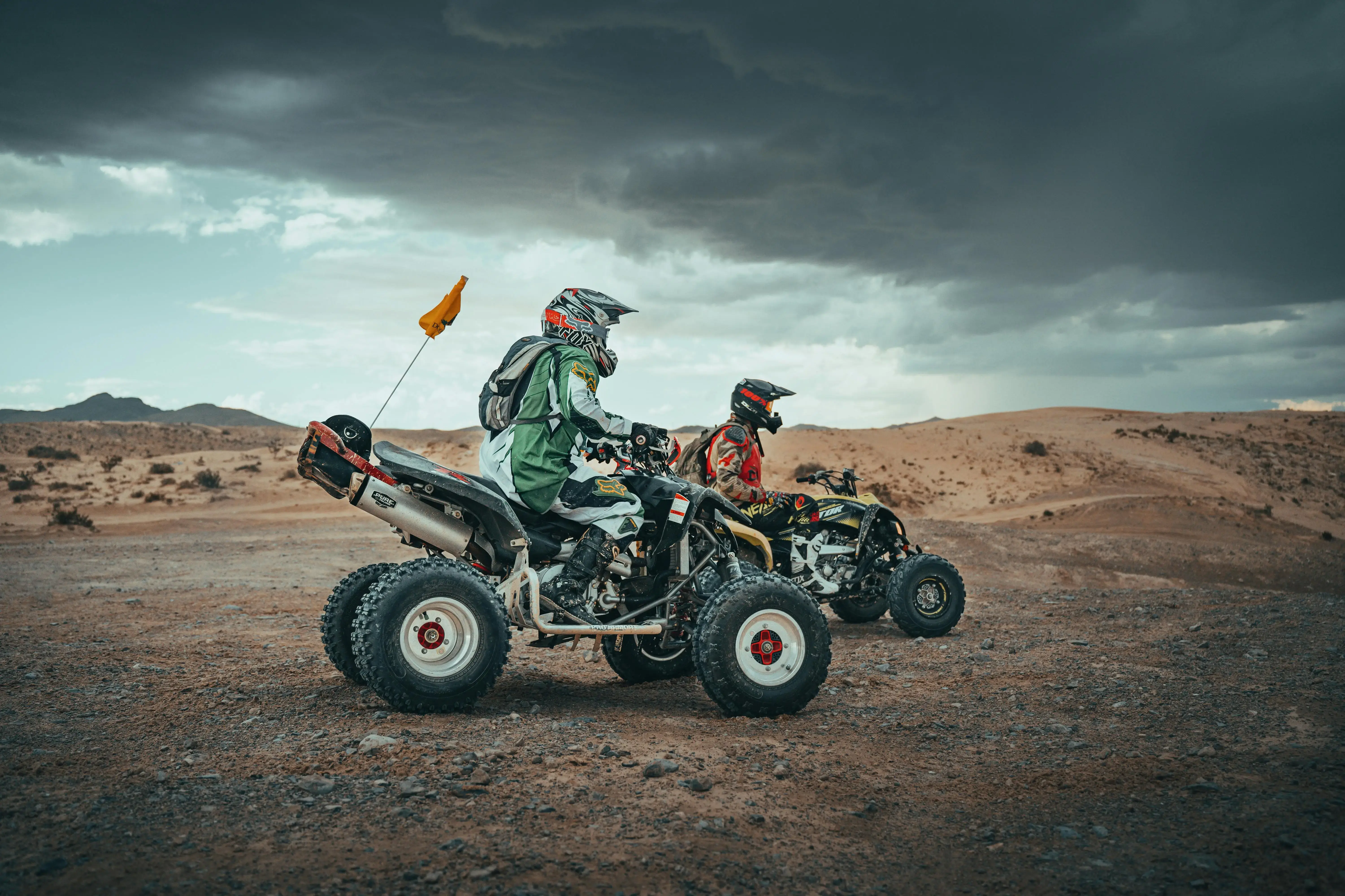 Men Riding Quads on Desert