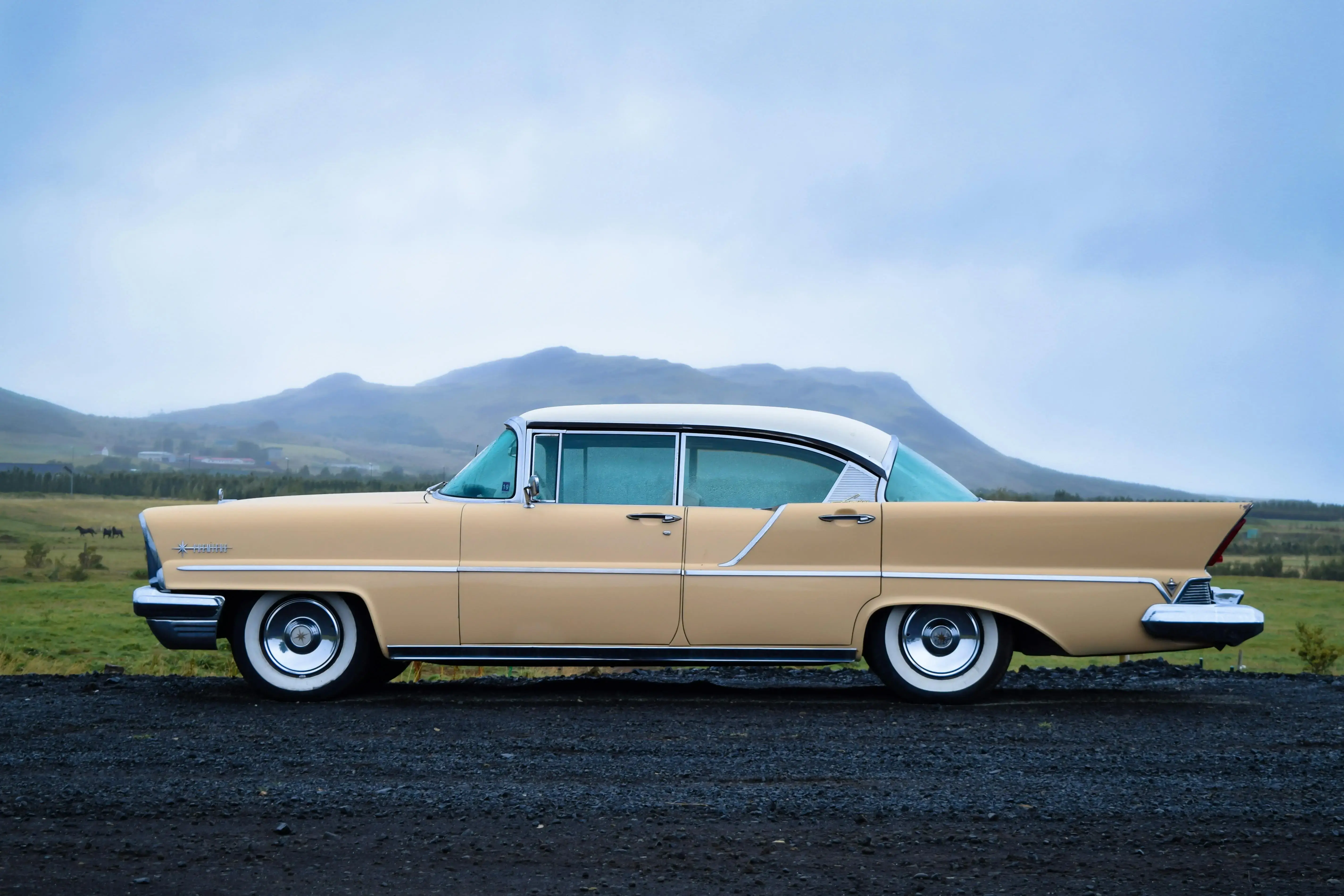 Side View of a White and Beige Vintage Car