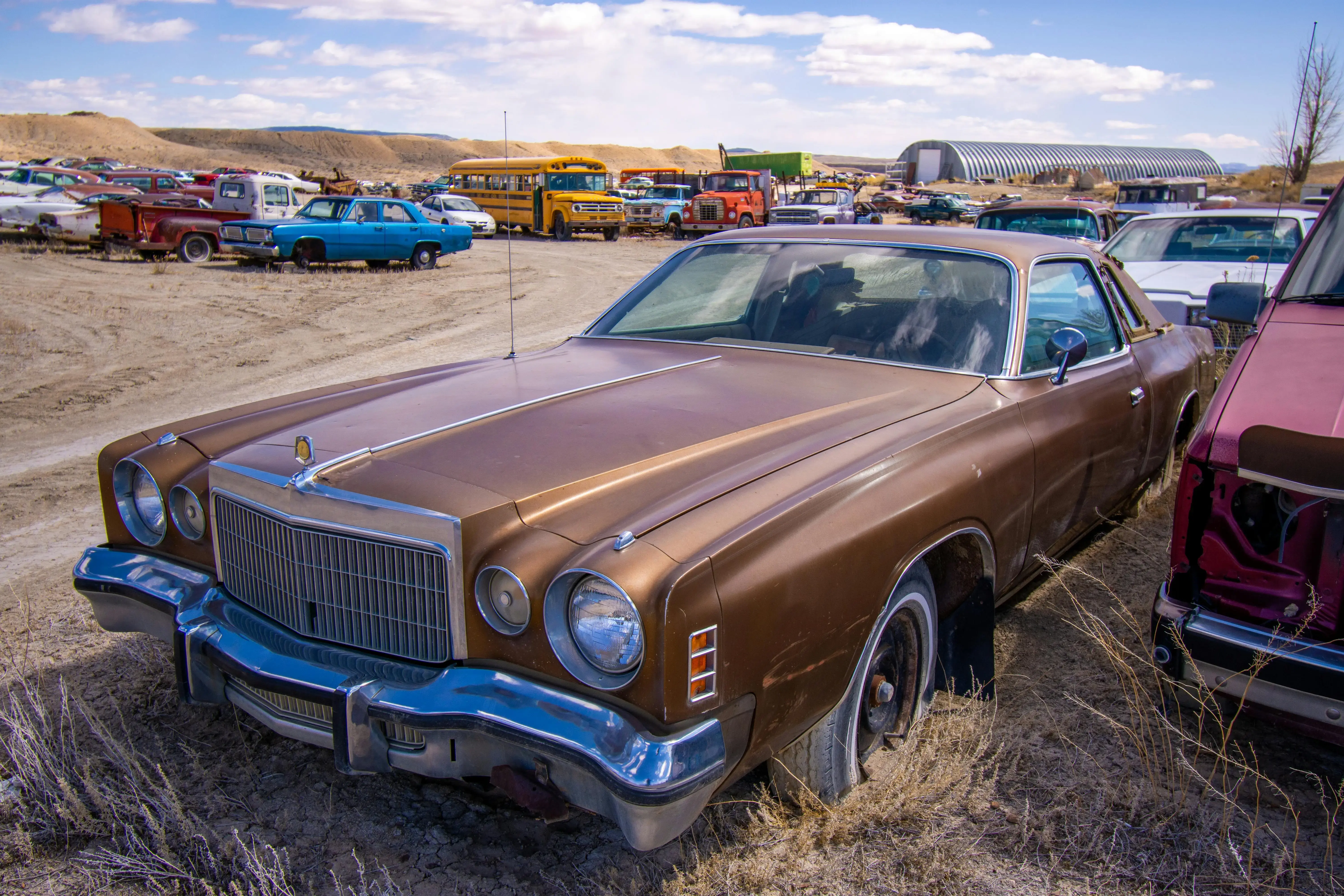 A Vintage Car on a Junkyard