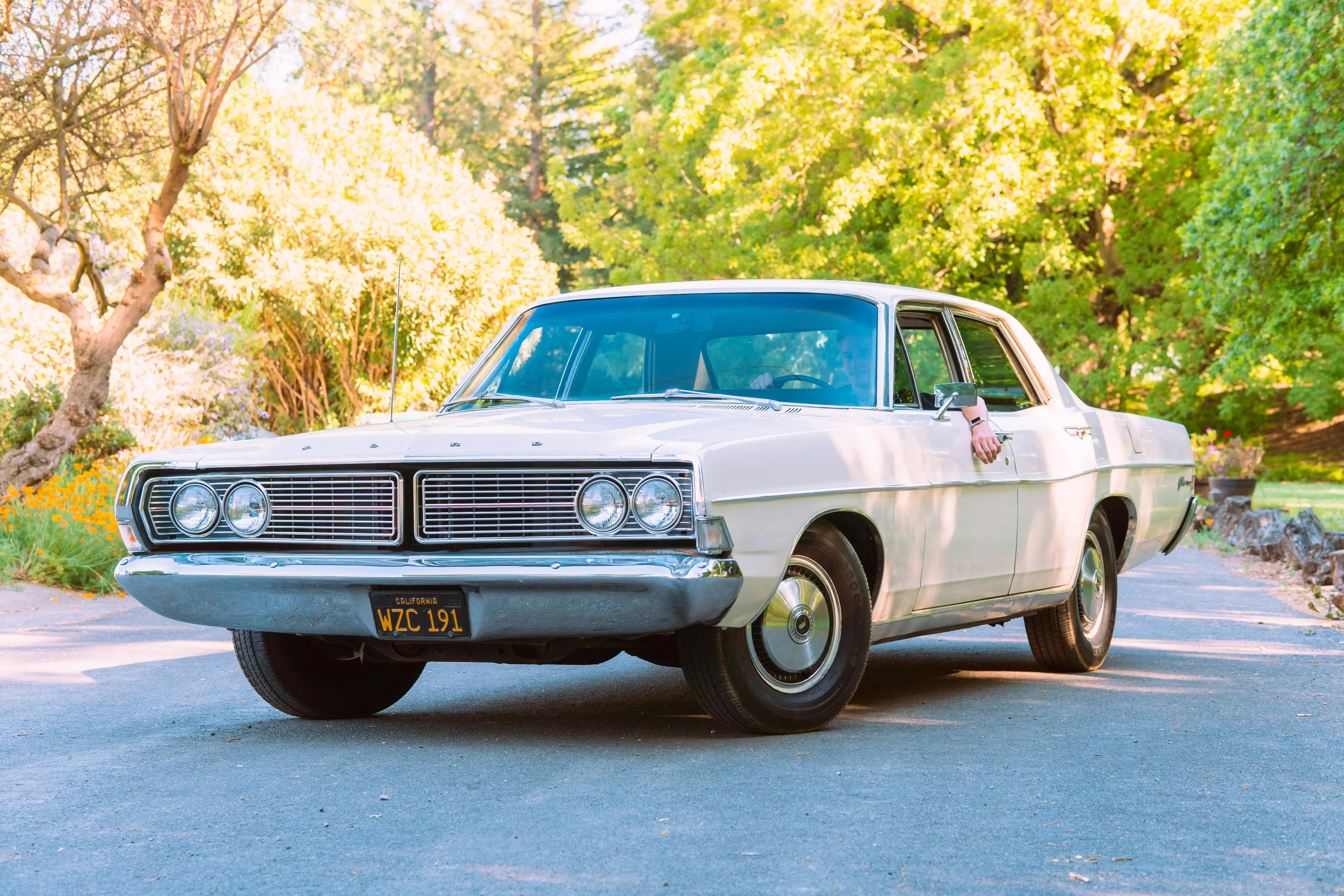 White Vintage Car on the Middle of the Road