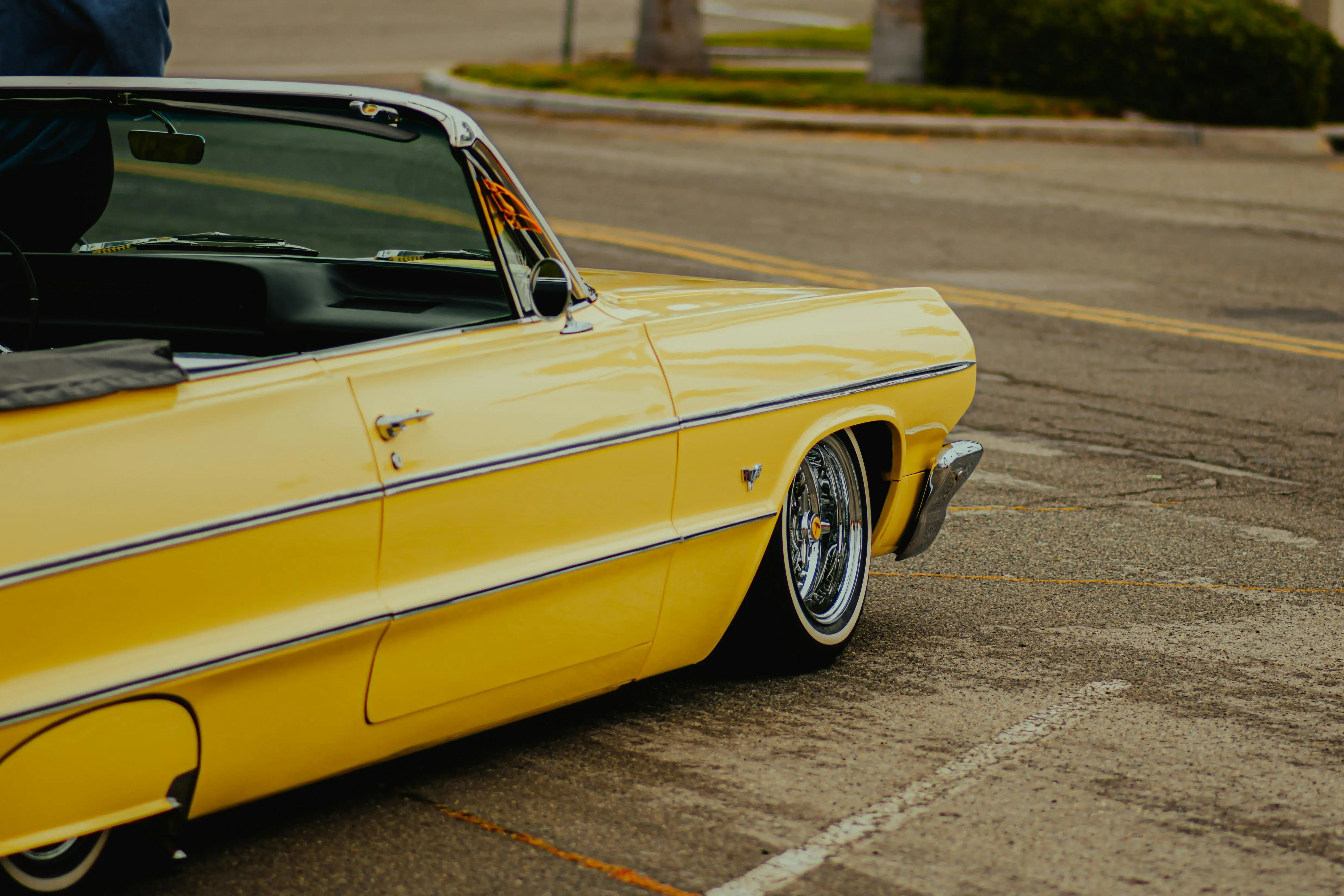 Classic Yellow Convertible Car on Urban Road
