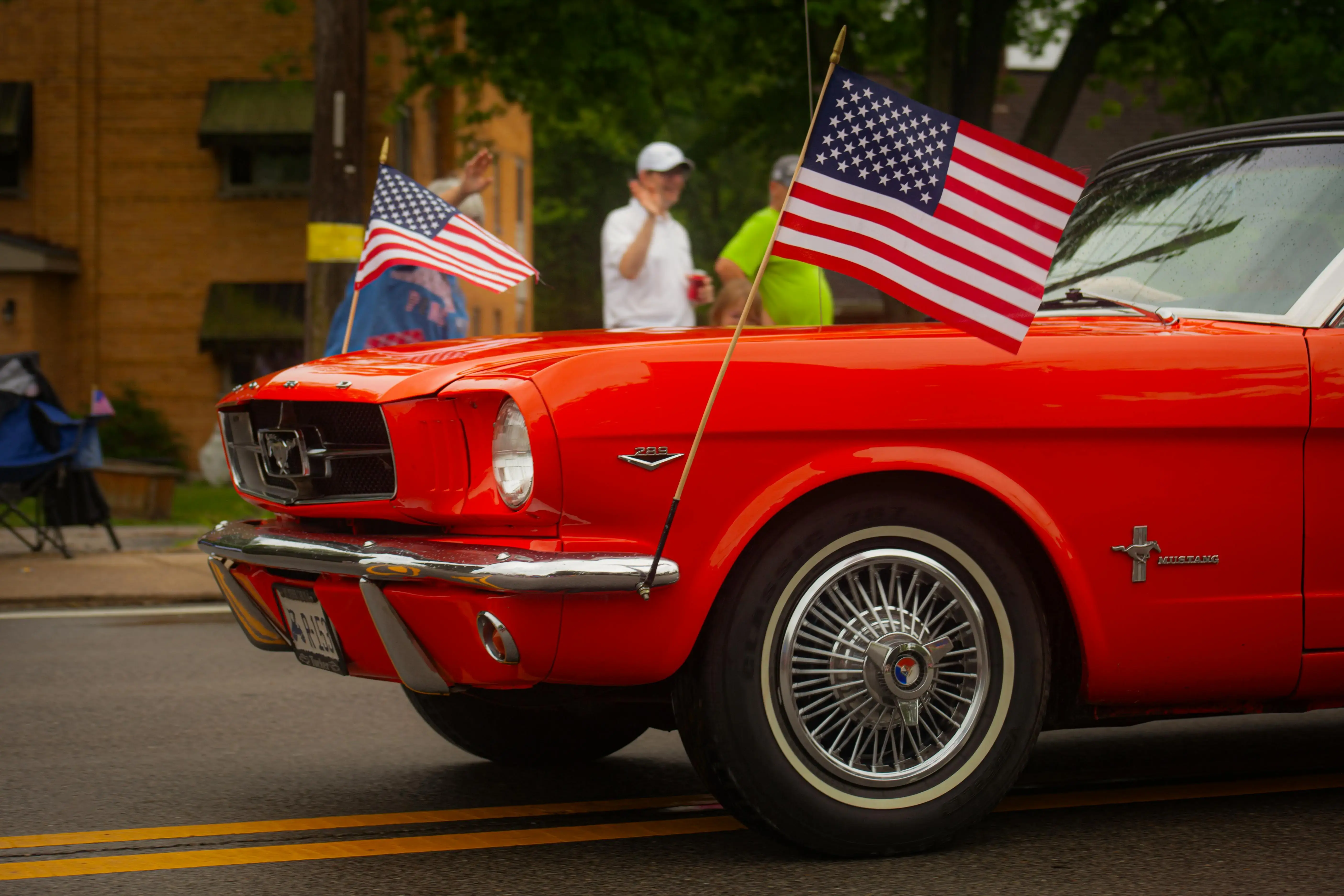 Red Ford Mustang with Flags of the USA