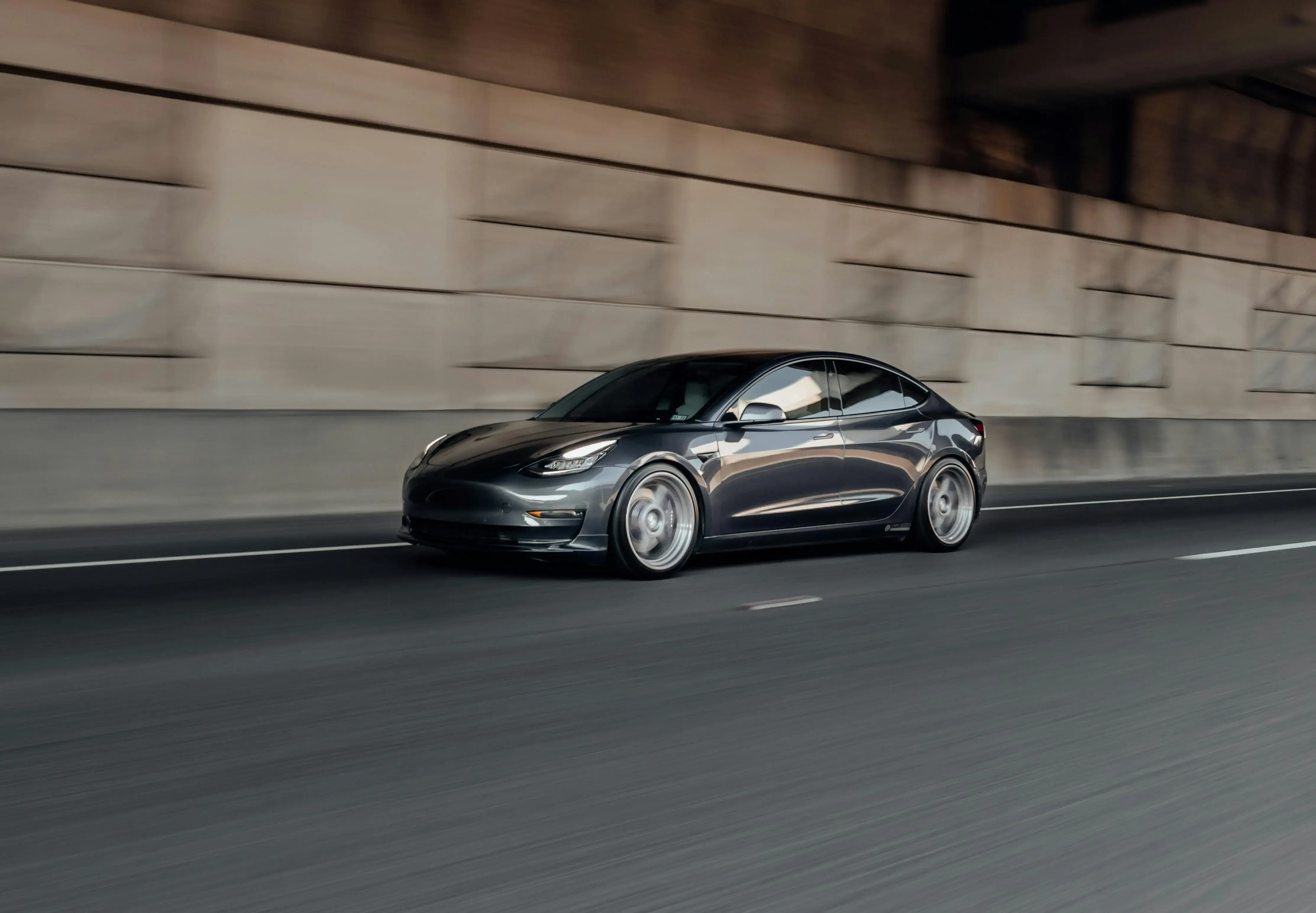 A Black Coupe Car on the Road