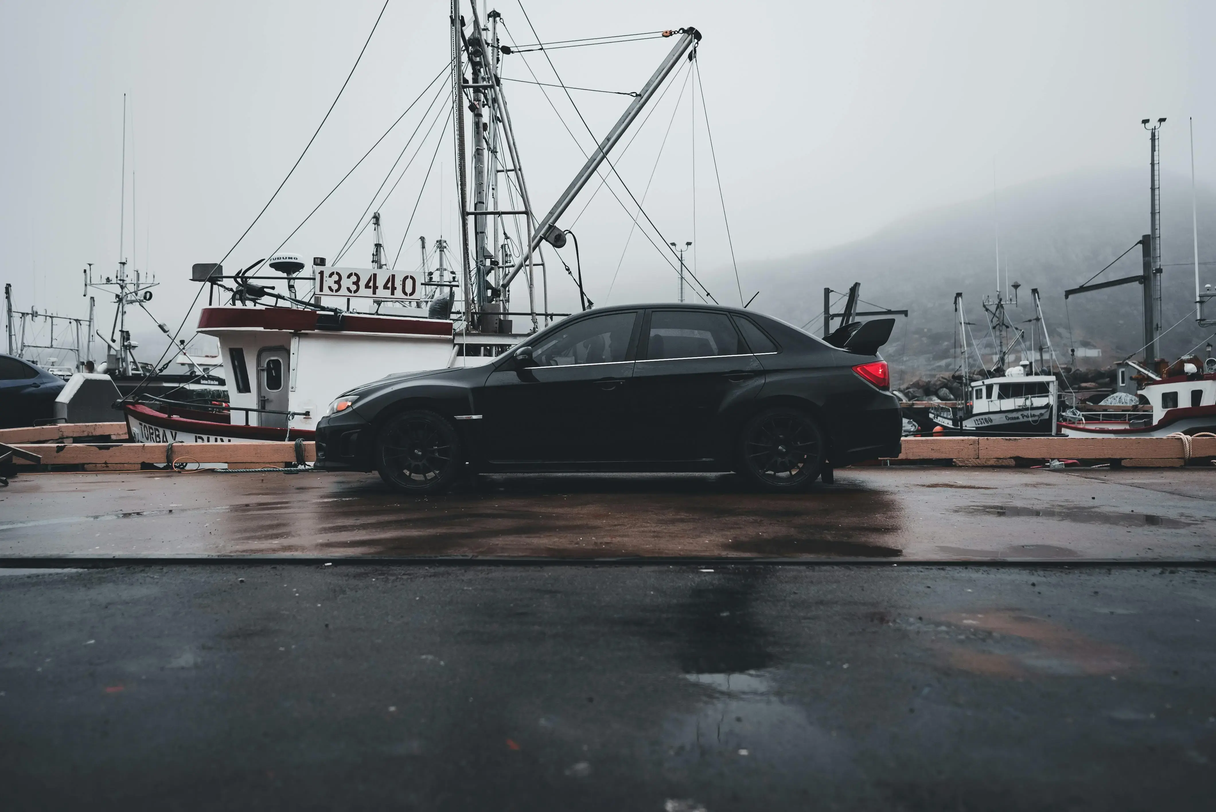 A Black Subaru WRX Parked in the Port