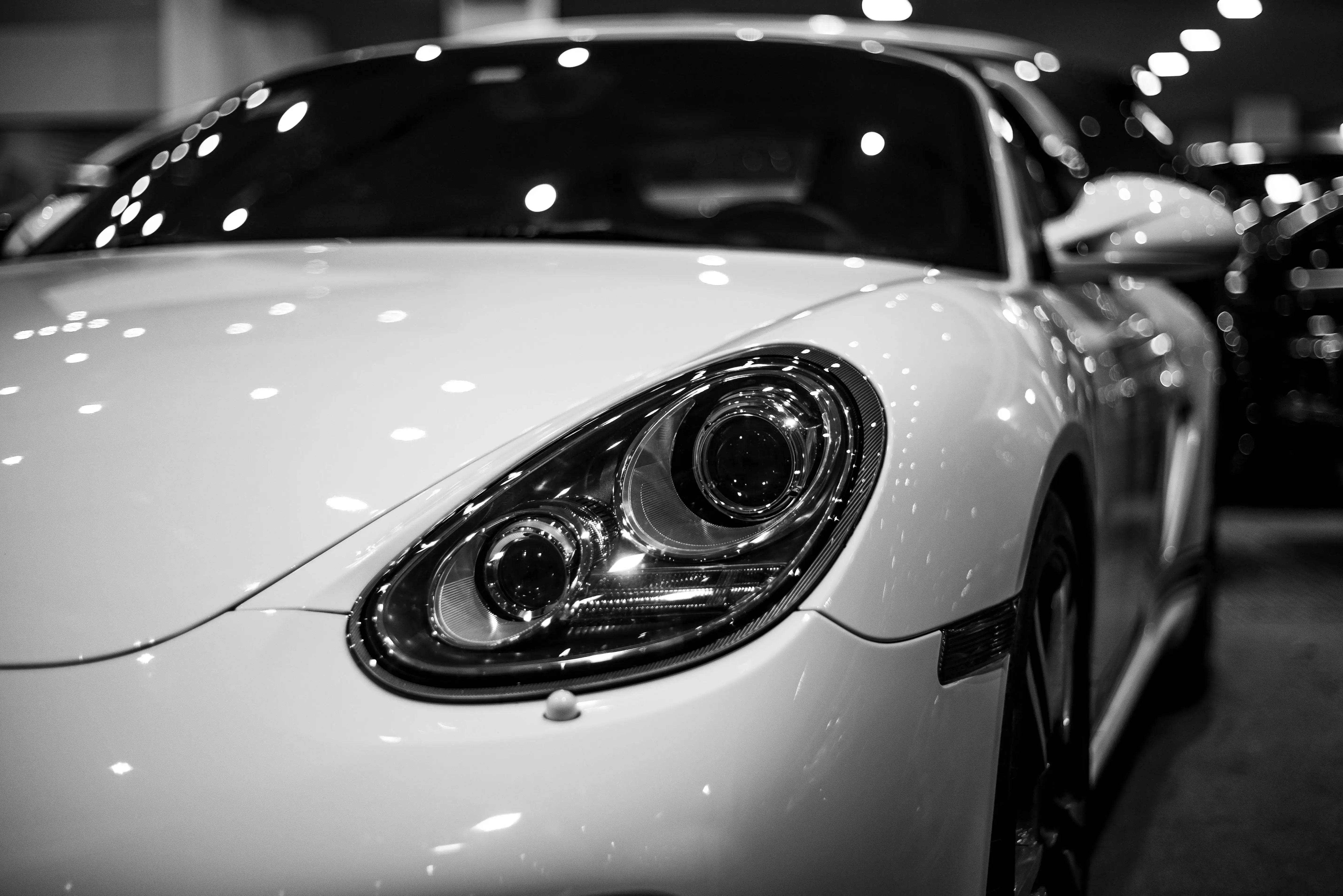 Sleek Luxury Car in Showroom with Spotlights