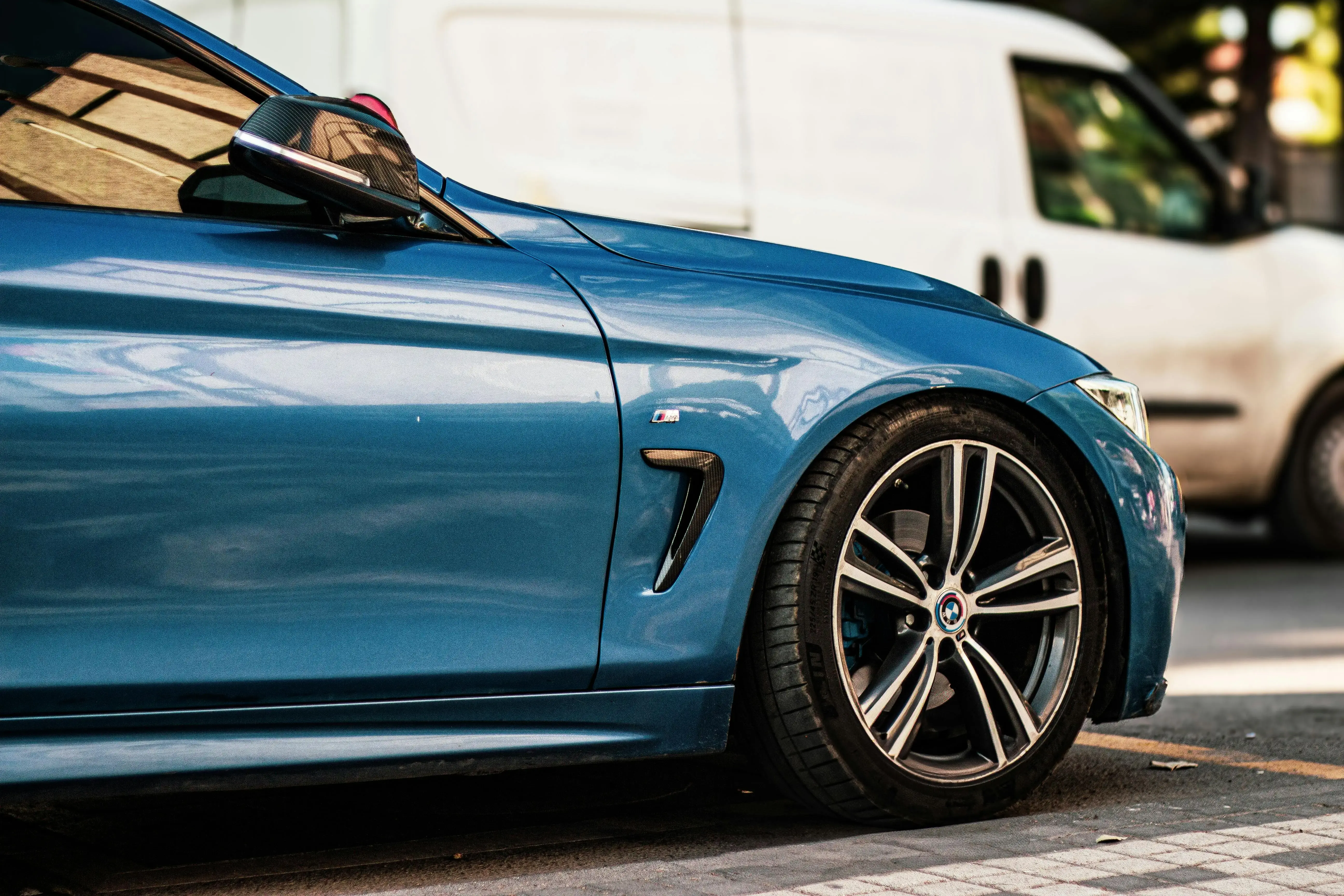 Close-up of a Blue Car in Urban Setting