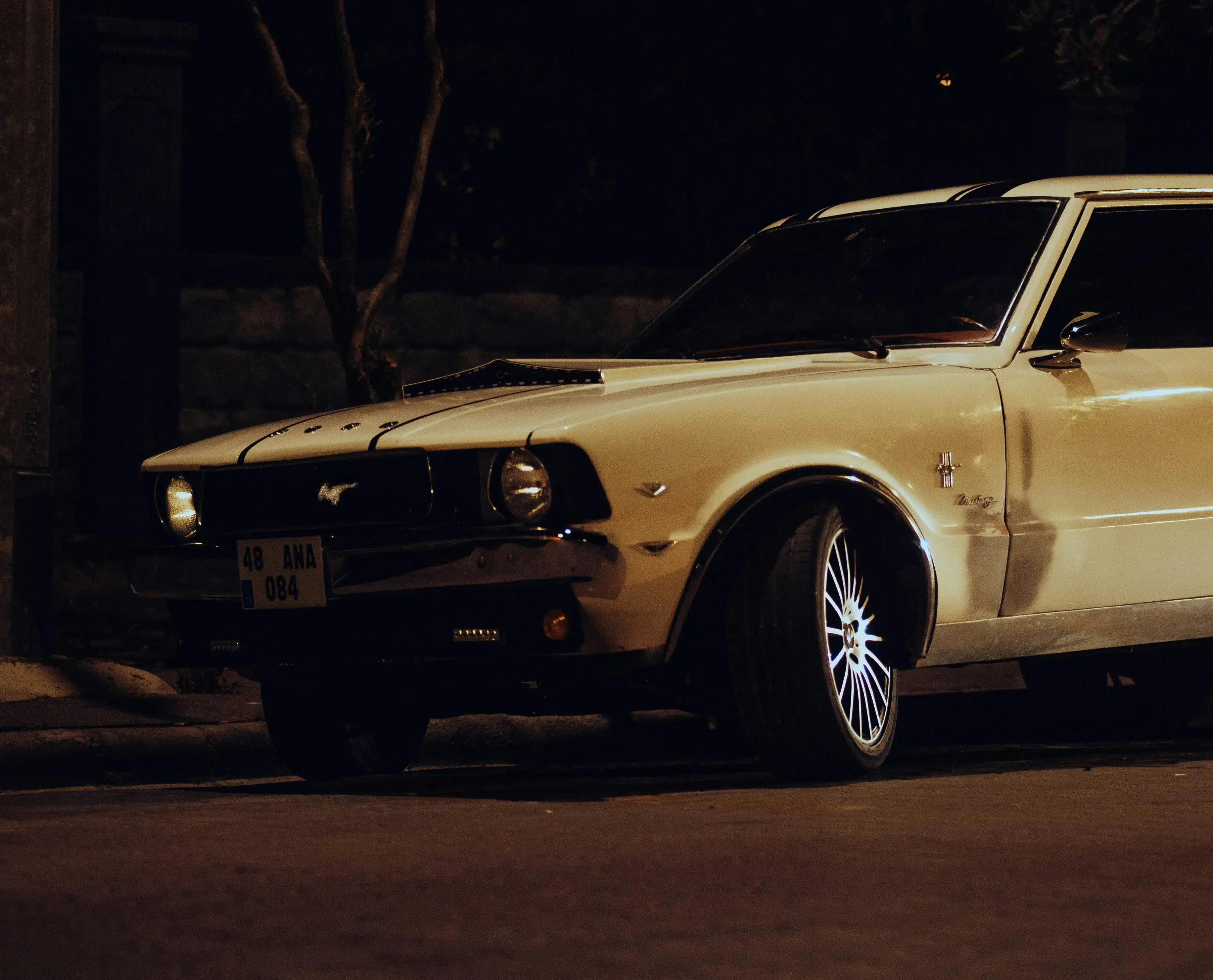 White Ford Mustang on Street at Night