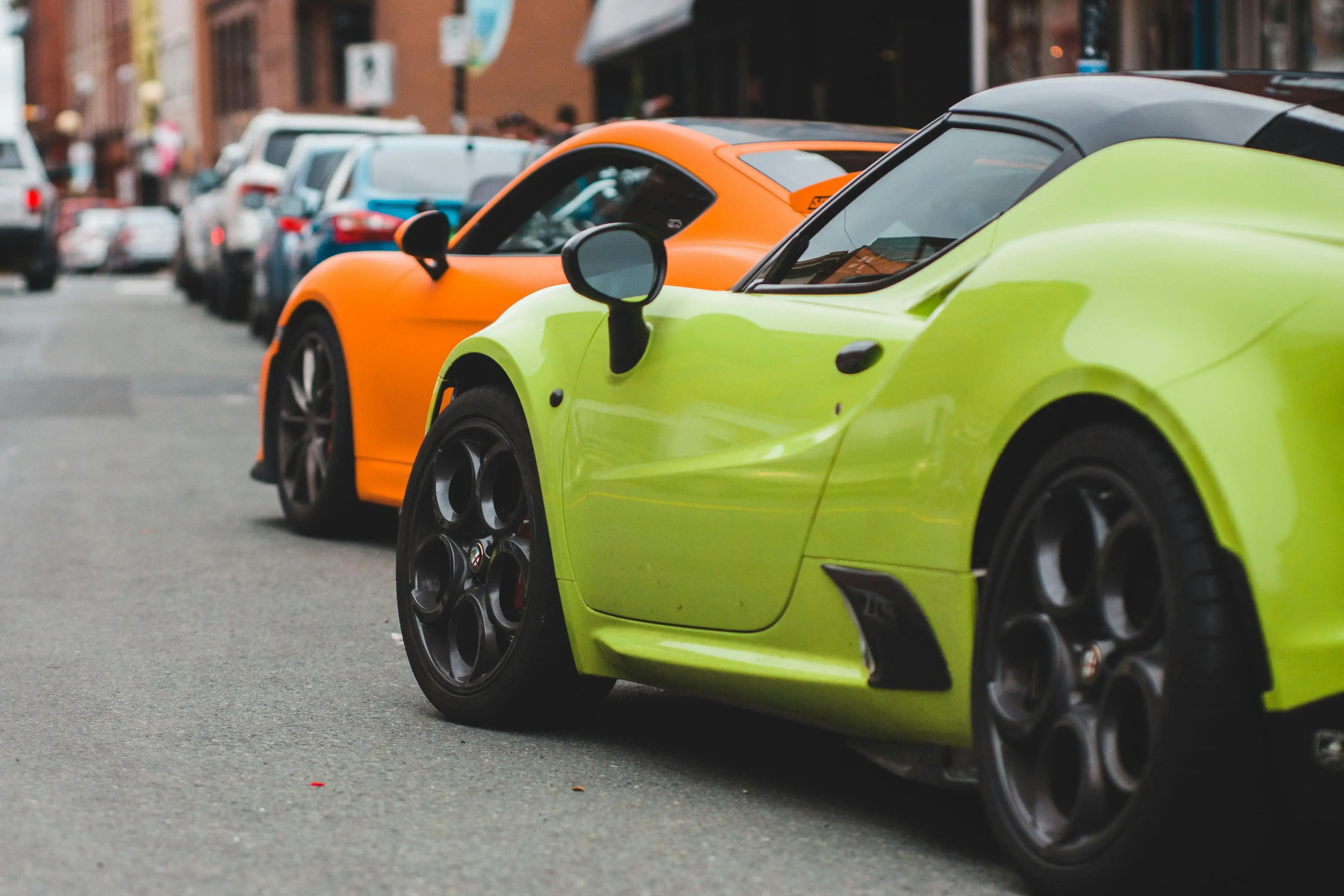 Modern racing cars on road in city