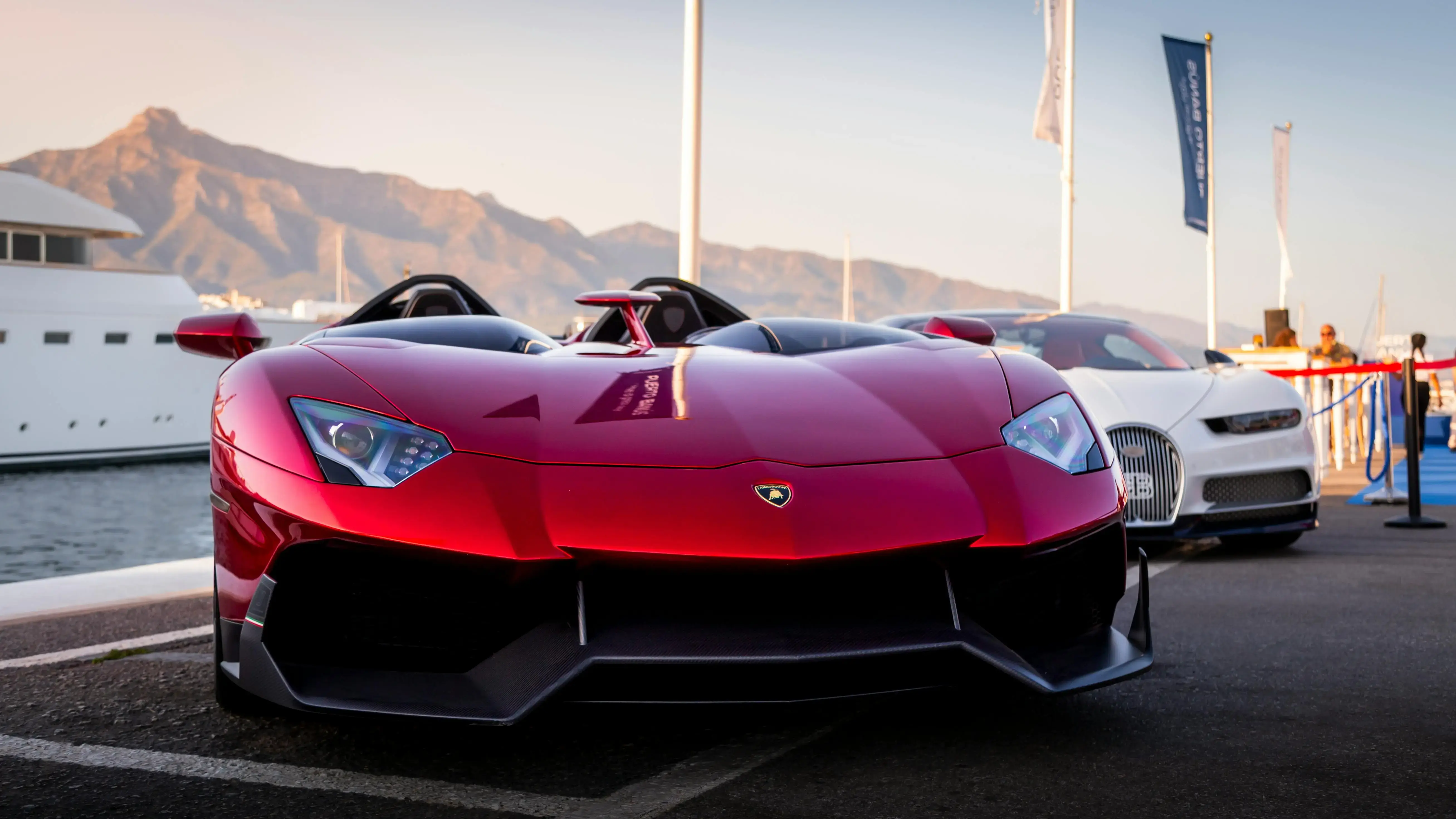 Stunning Red Supercar at Marina with Mountain View
