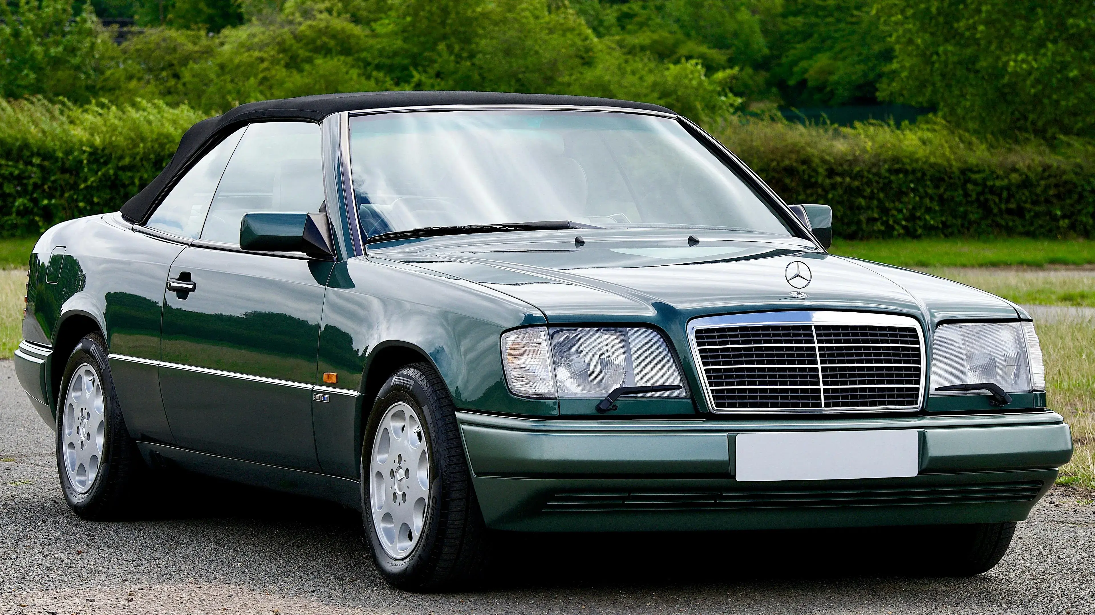 Green Mercedes Benz Car Parked on the Street