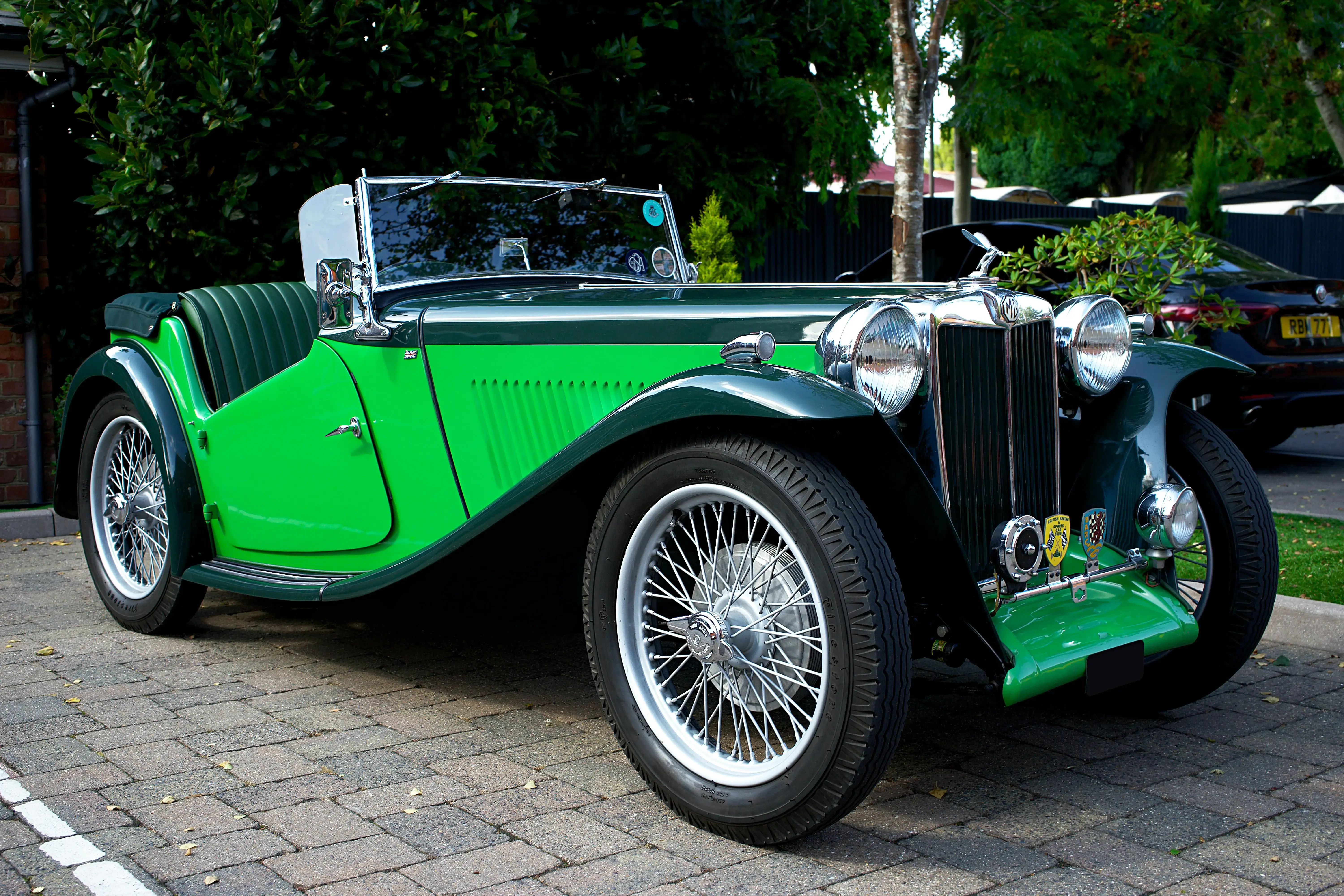 Green and Black Classic Car Parked Near Trees