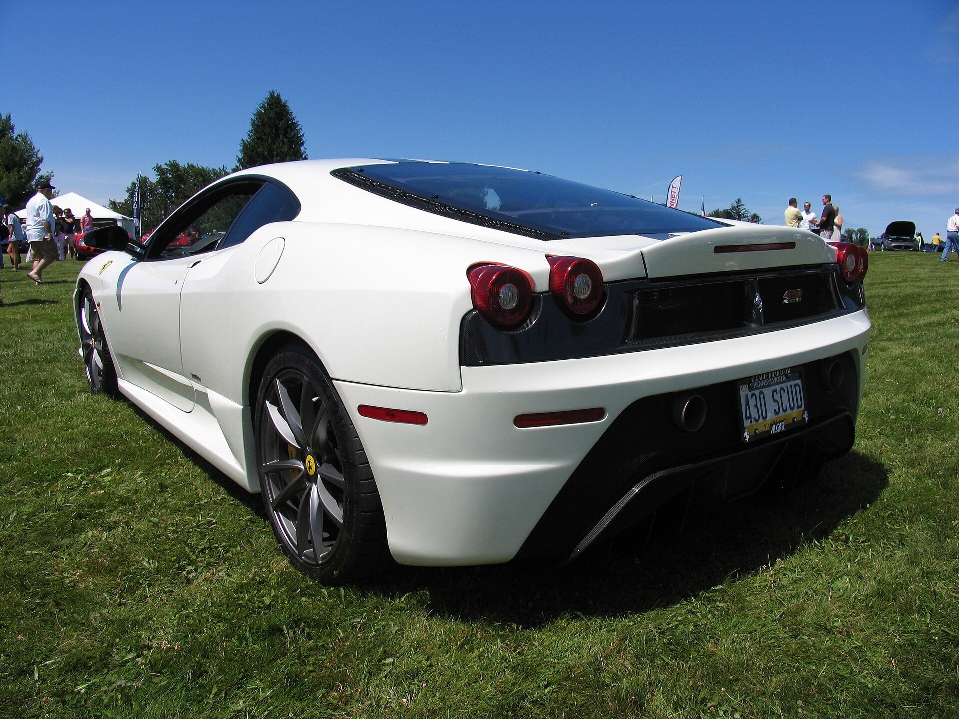 White Ferrari 430 Scuderia at an outdoor car show