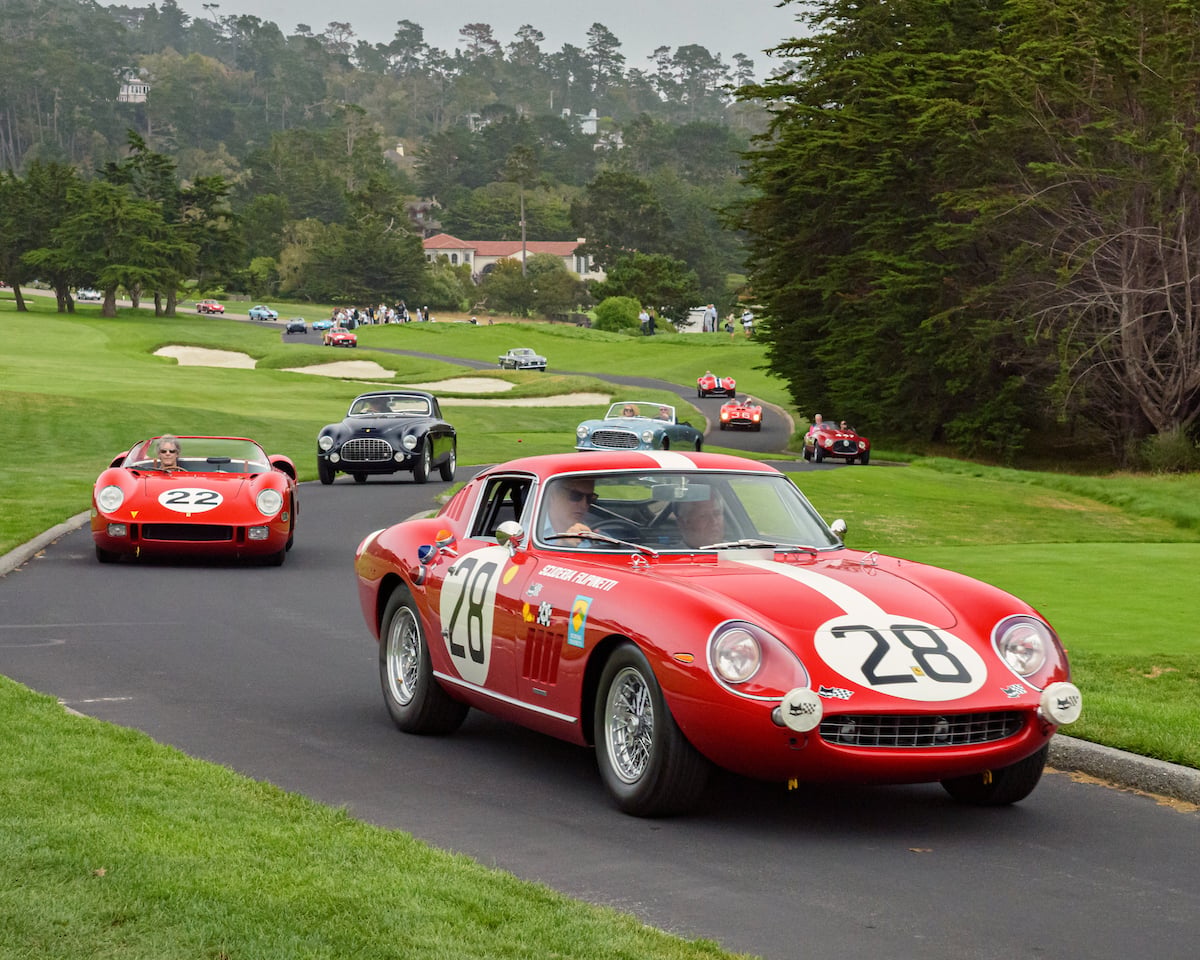 Ferraris driving on the Pebble Beach Concours d'Elegance fairway during Monterey Car Week